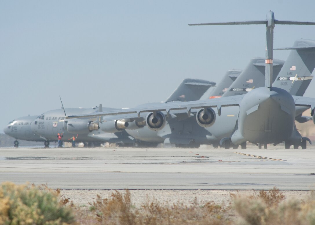C-17 Globemaster IIIs taxi prior to a six-ship formation testing March 17. The Global Reach Combined Test Force concluded a colossal mission of performing a formation test with six C-17s March 14 and 17. (U.S. Air Force photo/Mike Cassidy)