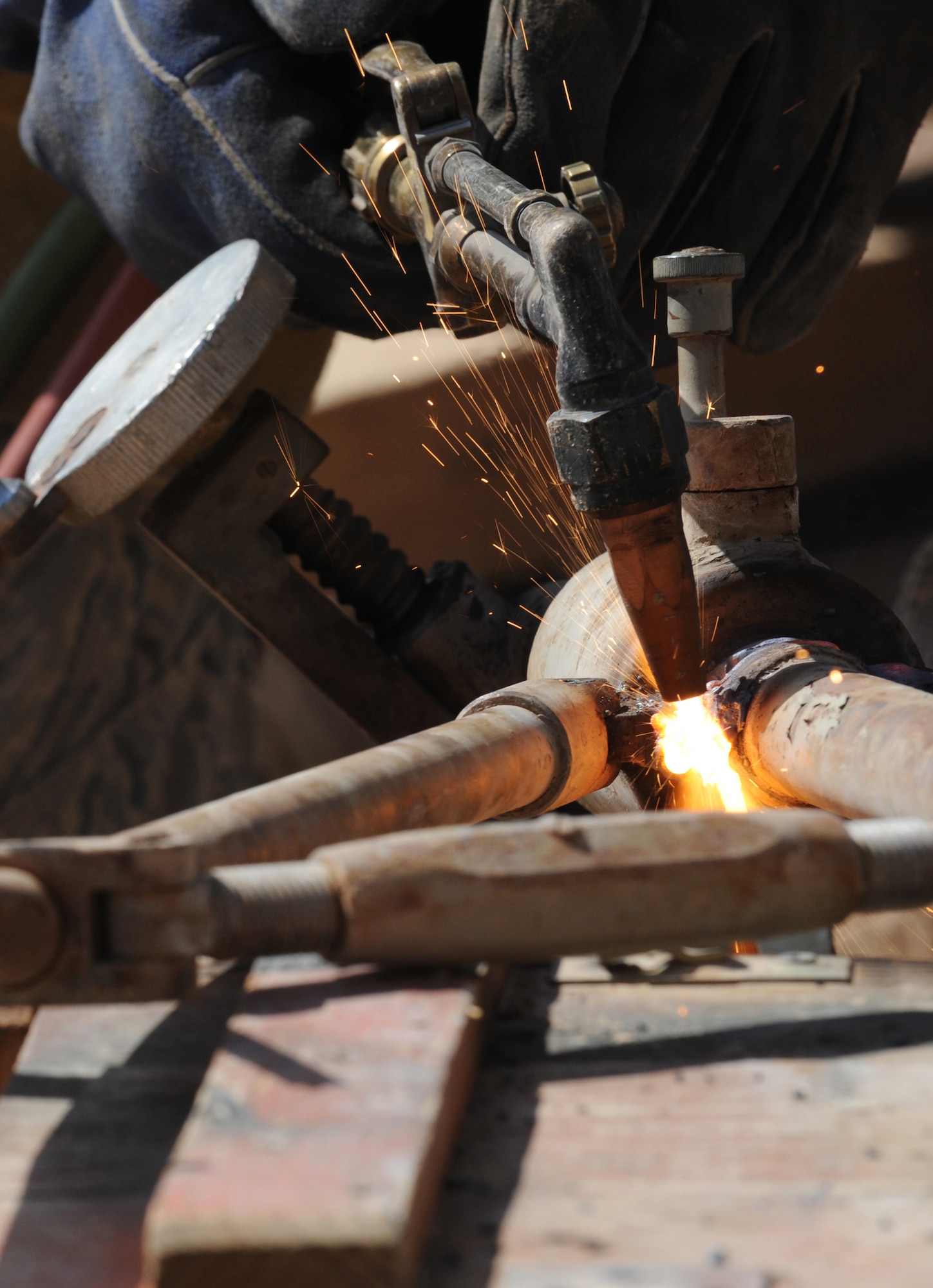 Tech. Sgt. Roy Hurd uses an oxy-acetylene torch to cut up enemy weapons at Joint Base Balad, Iraq, March 18. The weapons were turned in by units and are being destroyed so they cannot be used against coalition forces or Iraqis. Sergeant Hurd is a 332nd Expeditionary Civil Engineer Squadron structural journeyman. (U.S. Air Force photo/Senior Airman Elizabeth Rissmiller)