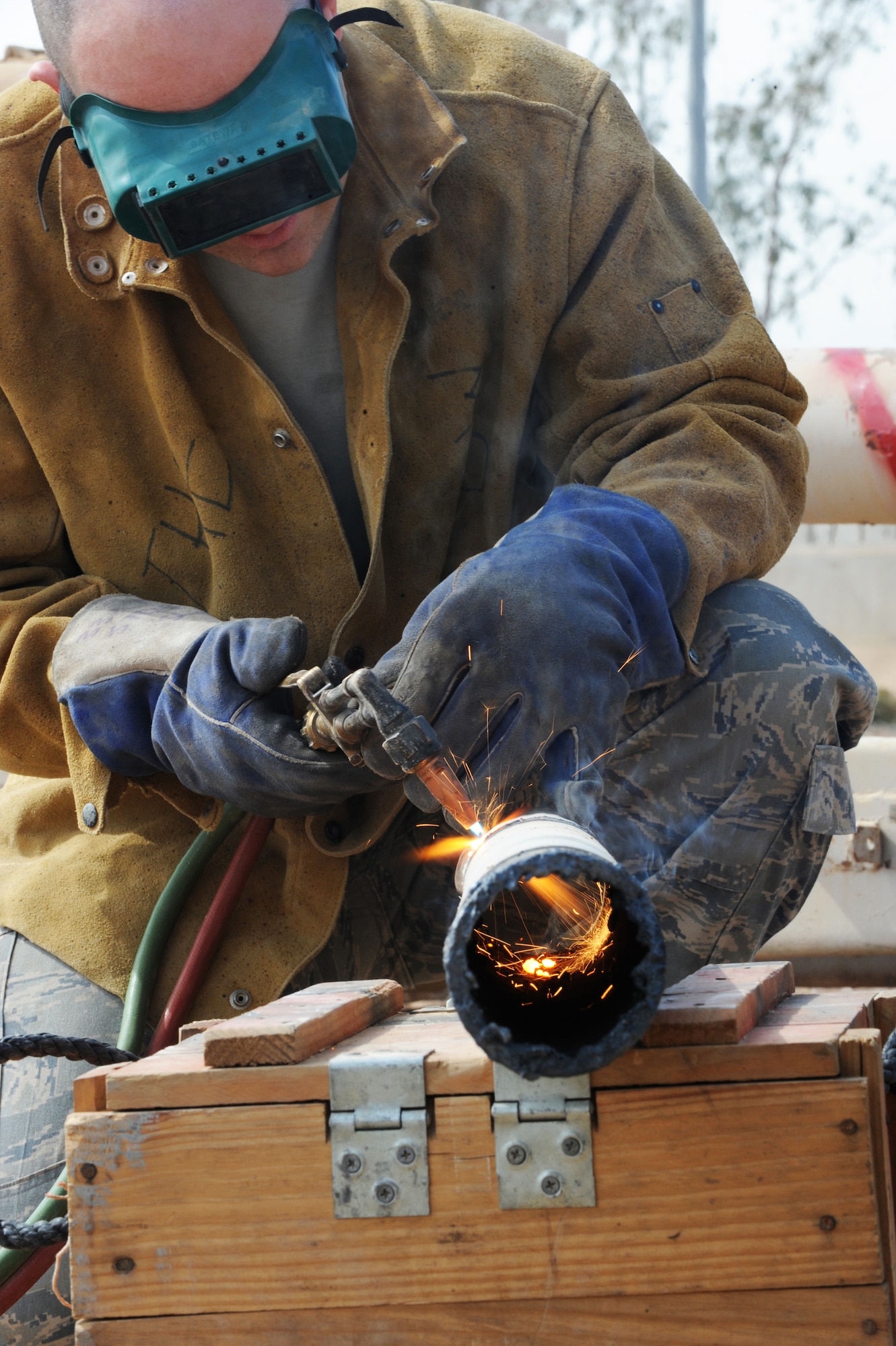 Tech. Sgt. Roy Hurd uses an oxy-acetylene torch to cut up enemy weapons at Joint Base Balad, Iraq, March 18. The weapons, which were turned in by units and are being destroyed so they cannot be used against coalition forces or Iraqis. Sergeant Hurd is a 332nd Expeditionary Civil Engineer Squadron structural journeyman. (U.S. Air Force photo/Senior Airman Elizabeth Rissmiller)