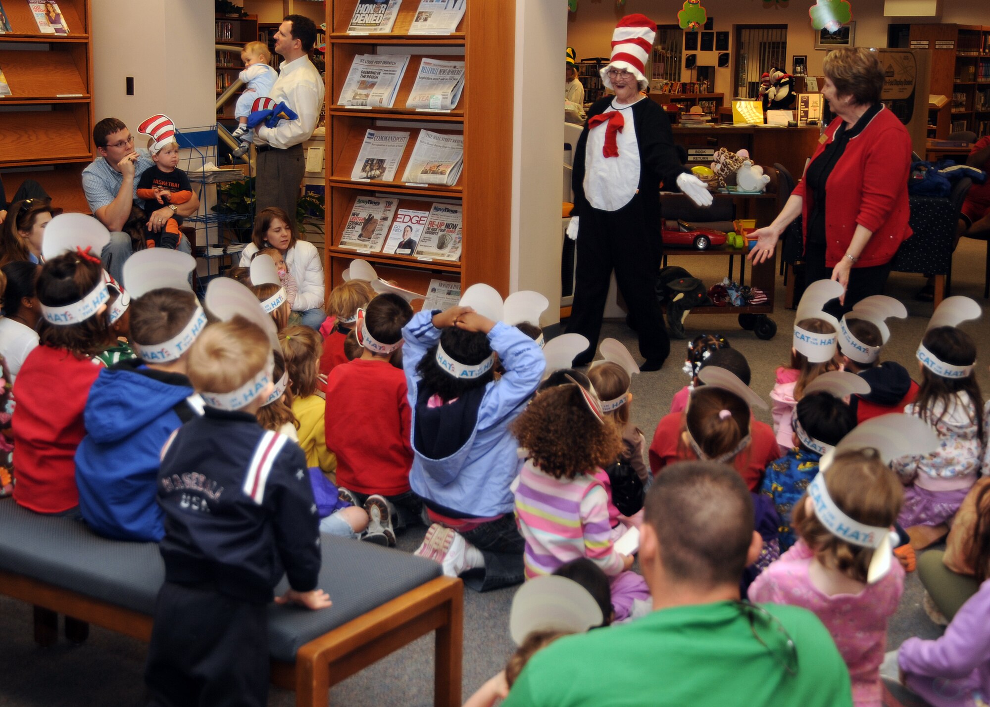 SCOTT AIR FORCE BASE, Ill. --Dr. Seuss night made its yearly return to the base library Thursday night as more than 50 kids showed up to hear some of the latest stories. “Are you my mother” was read by Sandy Koontz, library director, and Dee Bayley, library technician. The night also included a visit by Dr. Seuss as well as free gifts such as stickers, bookmarks and hats for children in attendance. (U.S. Air Force photo/Airman 1st Class Wesley Farnsworth)