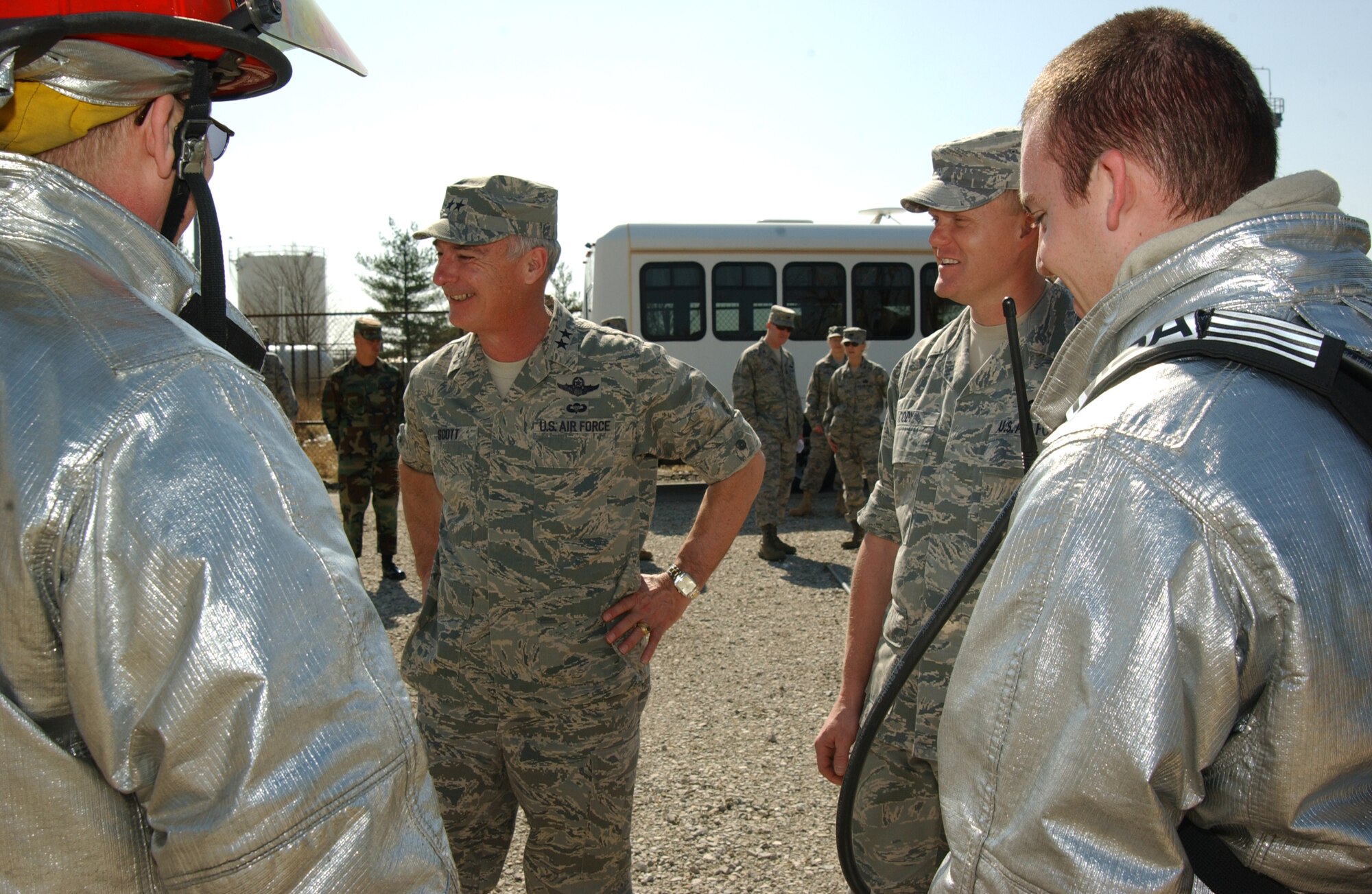 SCOTT AIR FORCE BASE, Ill. --Maj. Gen. Winfield Scott III, 18th Air Force commander, and Chief Master Sgt. James Cody, 18th AF command chief, meet with 375th Airlift Wing Civil Engineer Squadron firefighters after they demonstrated how to extinguish a structural fire. (U.S. Air Force photo/Airman 1st Class Amber Kelly-Woodward) 