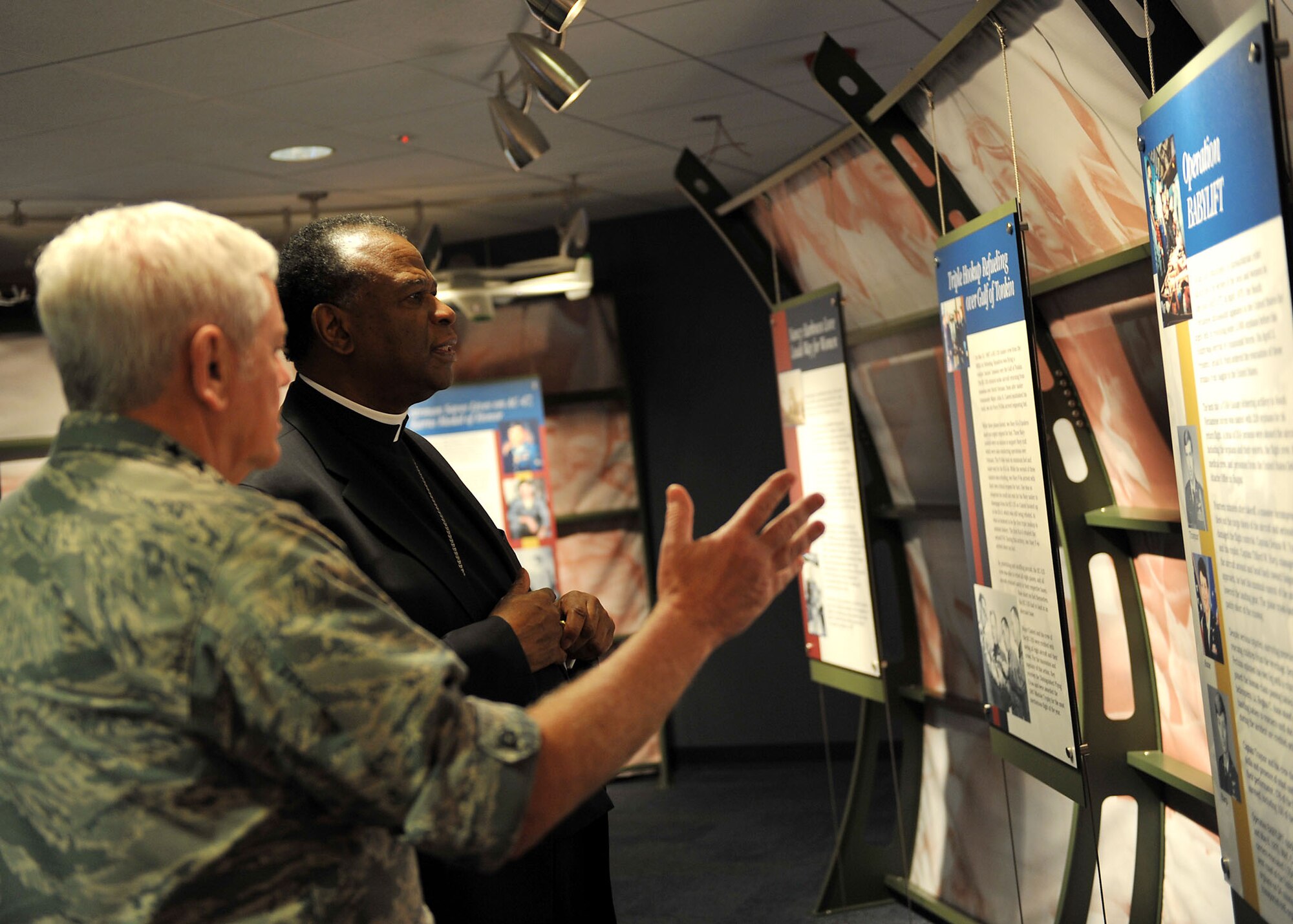 SCOTT AIR FORCE BASE, Ill. -- Gen. Arthur Lichte, Air Mobility Command commander, briefs His Excellency, The Most Reverend Edward K. Braxton, Catholic Bishop of Belleville, on the mission of AMC. Bishop Braxton received briefings, toured a C-40 aircraft, and met with Scott AFB Airmen at the Airmen Ministry Center during a base visit March 20.U.S. Air Force photo/Senior Airman Megan Gilliland)