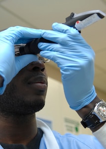 Senior Airman Alex Hastings performs a manual specific gravity test for dehydration, hormone balances among several other items on an urine sample  at the Clinical Laboratory on Charleston AFB, March 23. The lab receives more than 500 blood and urine samples weekly. Airman Hastings is a laboratory technician with the 437th Medical Group. (U.S. Air Force photo/Senior Airman Katie Gieratz)