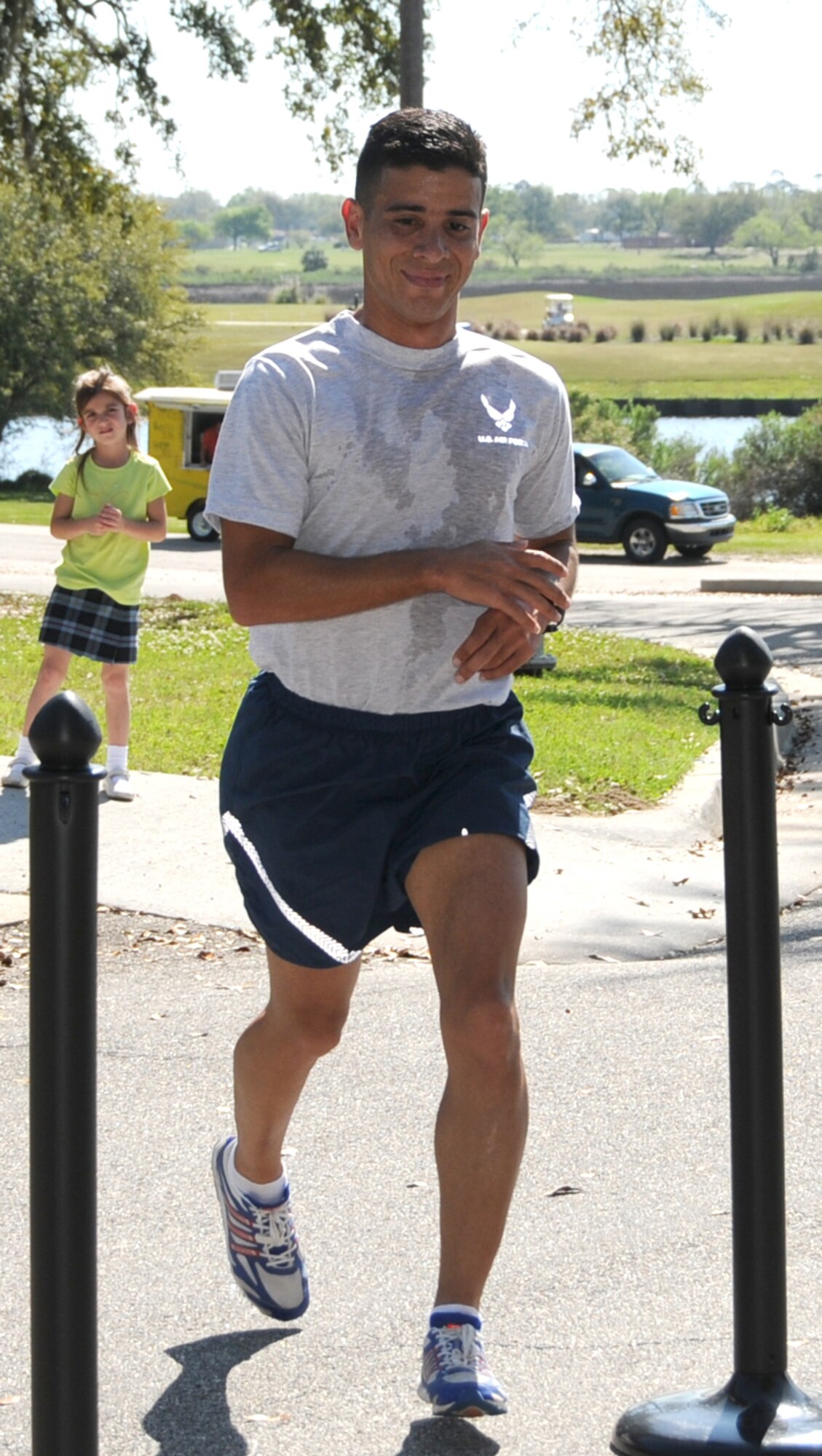 Jose Espola-Negron, left, 334th Training Squadron, and Maria McElroy, 2nd Air 
Force, were the top male and female runners in the St. Paddy’s Day 5-kilometer run, March 17.  Espola-Negron finished in 18 minutes, 44 seconds.  McElroy posted a time of 25:40.  (U.S. Air Force photos by Kemberly Groue)