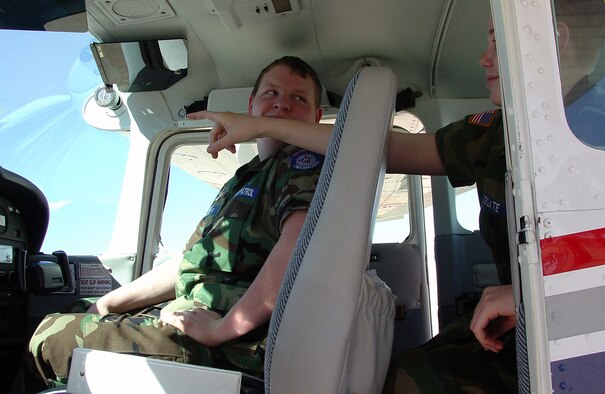 ALTUS AIR FORCE BASE, Okla. -- Cadet 2nd Lt. Charlie Wolff (L) checks out the Civil Air Patrol aircraft with Cadet Airman Zack Legate. In addition to their Civil Air Patrol training, the cadets also volunteer to help the airport with airfield management duties. (U.S. Air Force photo/Kevin T. Chandler)
