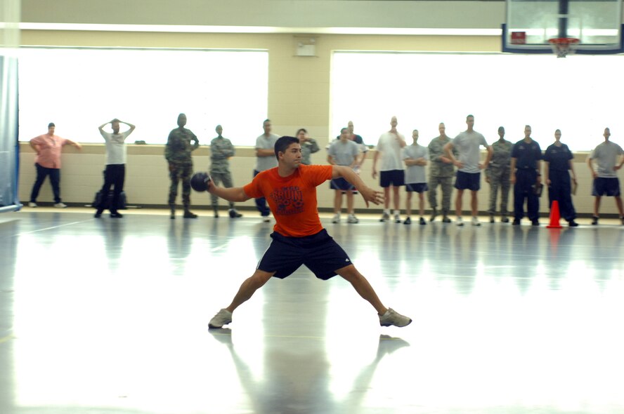 Senior Airman Andrew Vincent, playing for team FSV, gets ready to take a shot during the final sudden death match of the dodgeball championship. (2d Lt. Amy Abbott/U.S. Air Force)