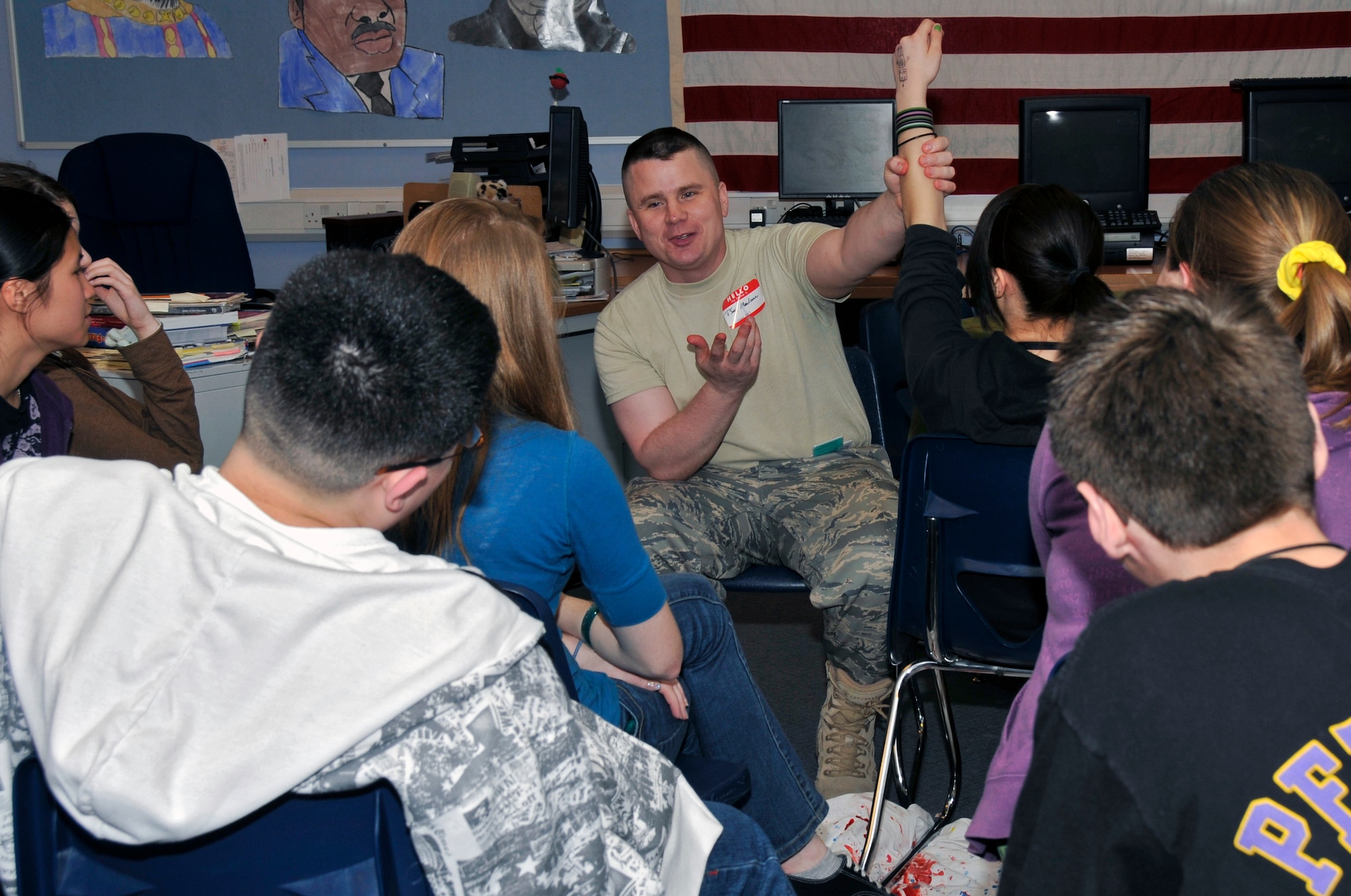 Tech Sgt. Victor Malone, 48th Medical Group NCO in charge of clinical education, briefs 8th graders on first responder techniques March 23, 2009 at RAF Feltwell, England. 48th Medical Group airmen visited the Lakenheath Middle School and briefed 8th graders on the dangers of drugs and alcohol, the importance of diet and exercise, dental care, coping with stress, and other topics. (U.S. Air Force photo by Airman 1st Class Perry Aston) 