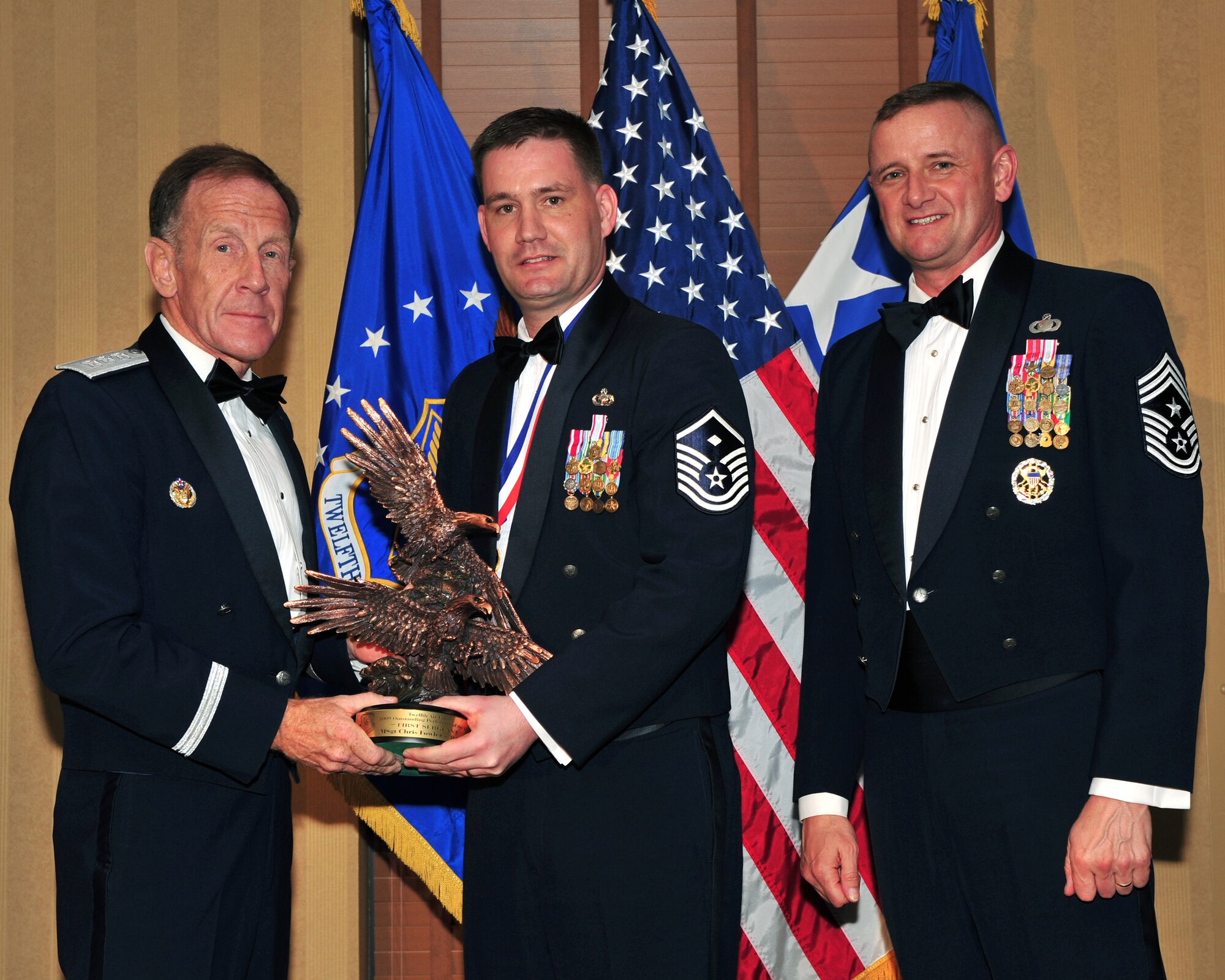 DAVIS MONTHAN AIR FORCE BASE, Ariz. -- Master Sgt. Christopher S. Fowler, 366th Logistics Readiness Squadron first sergeant, receives the Twelfth Air Force 2009 Outstanding Performer of the Year award in the first sergeant category March 11. Gunfighters took three of the nine awards. (U.S. Air Force photo)