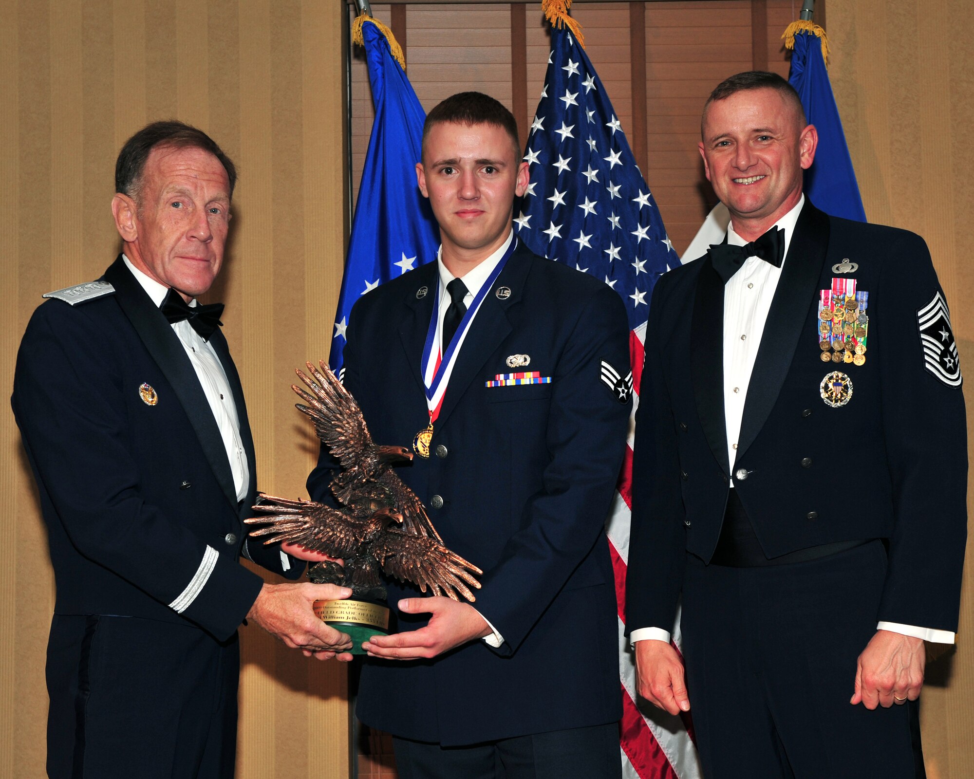 DAVIS MONTHAN AIR FORCE BASE, Ariz. -- Senior Airman Roy Mcallister, 366th Logistics Readiness Squadron refueling maintenance technician, receives the Twelfth Air Force 2009 Outstanding Performer of the Year award in the Airman category March 11. Gunfighters took three of the nine awards. (U.S. Air Force photo)