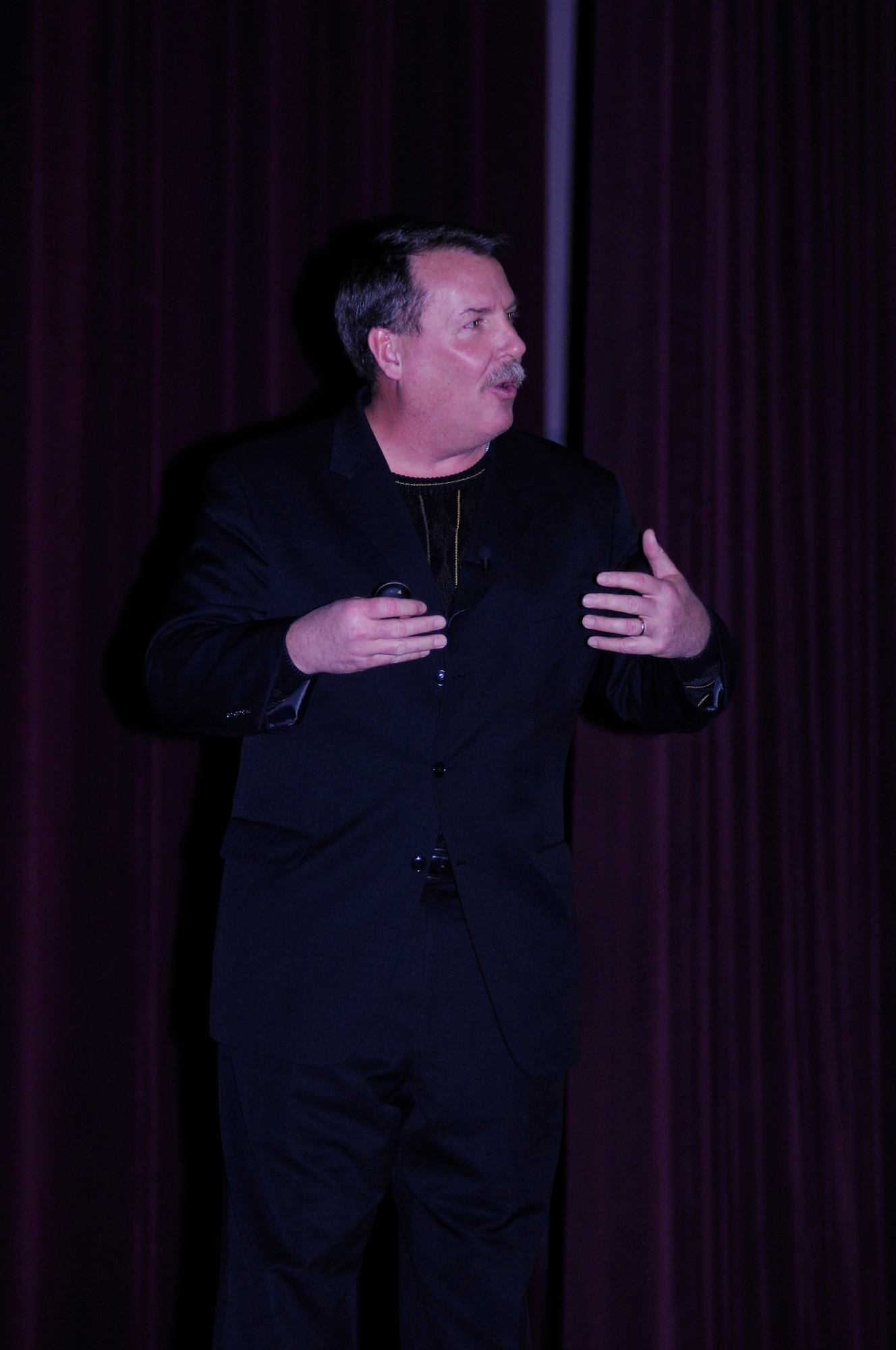 MINOT AIR FORCE BASE, N.D. -- Mr. James Hunter, of J.D. Hunter Associates, LLC, speaks to group of Aimen and civilians at the base theater here March 20. The 5th Mission Support Group brought in Mr. Hunter in an effort to bring in speakers once a quarter to discuss a topic that relates to professional development such as ethics, mentorship, and servant leadership. (U.S. Air Force photo by Staff Sgt. Thomas Dow)