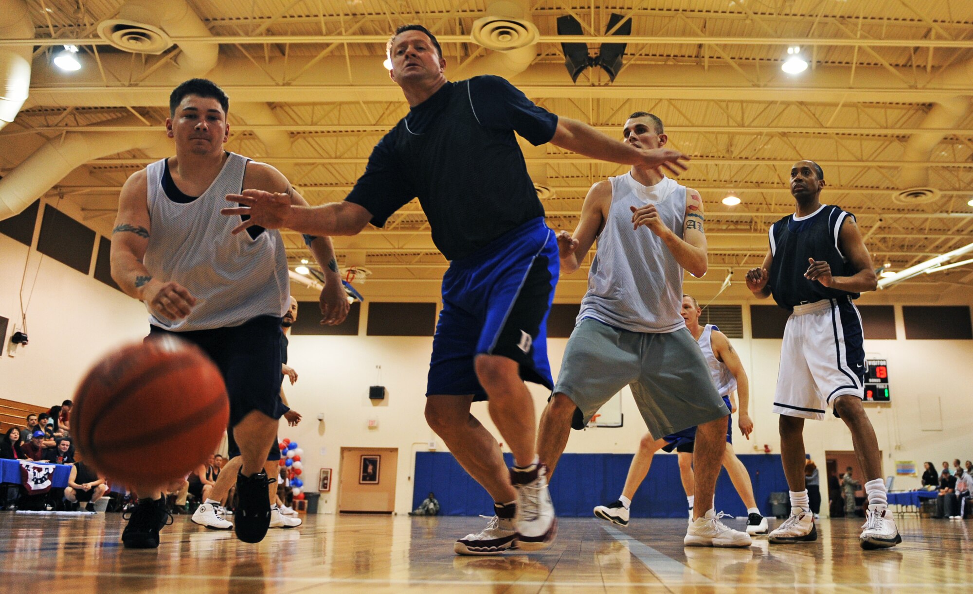 MOUNTAIN HOME AIR FORCE BASE, Idaho – Jay Jaques, over 30 all-star team, scrambles after the ball during the All Star Basketball Extravaganza at the Gunfighter Fitness Center March 20. The intramurals all-star team defeated the over 30 all-star team 61 to 43. (U.S. Air Force photo/Senior Airman Ryan Crane)