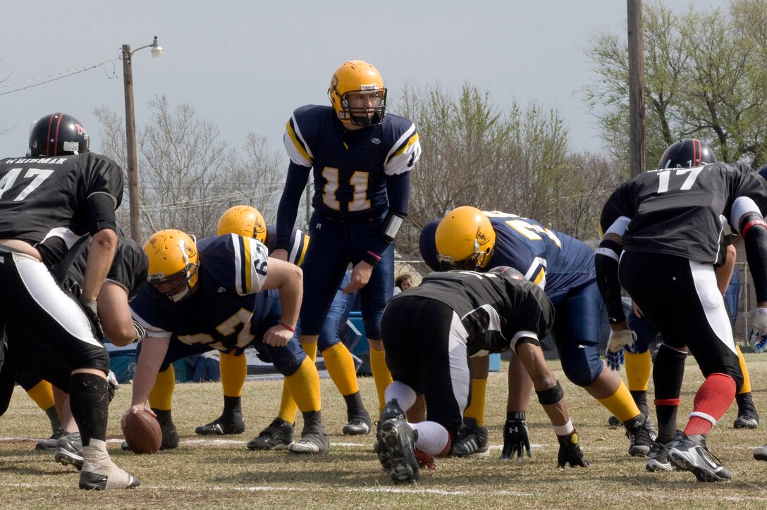 1st Lt. Chad McElvain, a Vance T-6 II Texan instructor pilot with the 33rd Flying Training Squadron and quarterback of the Enid Enforcers, prepares to call the next play on the football field. (Courtesy photo by Michael Kellner)