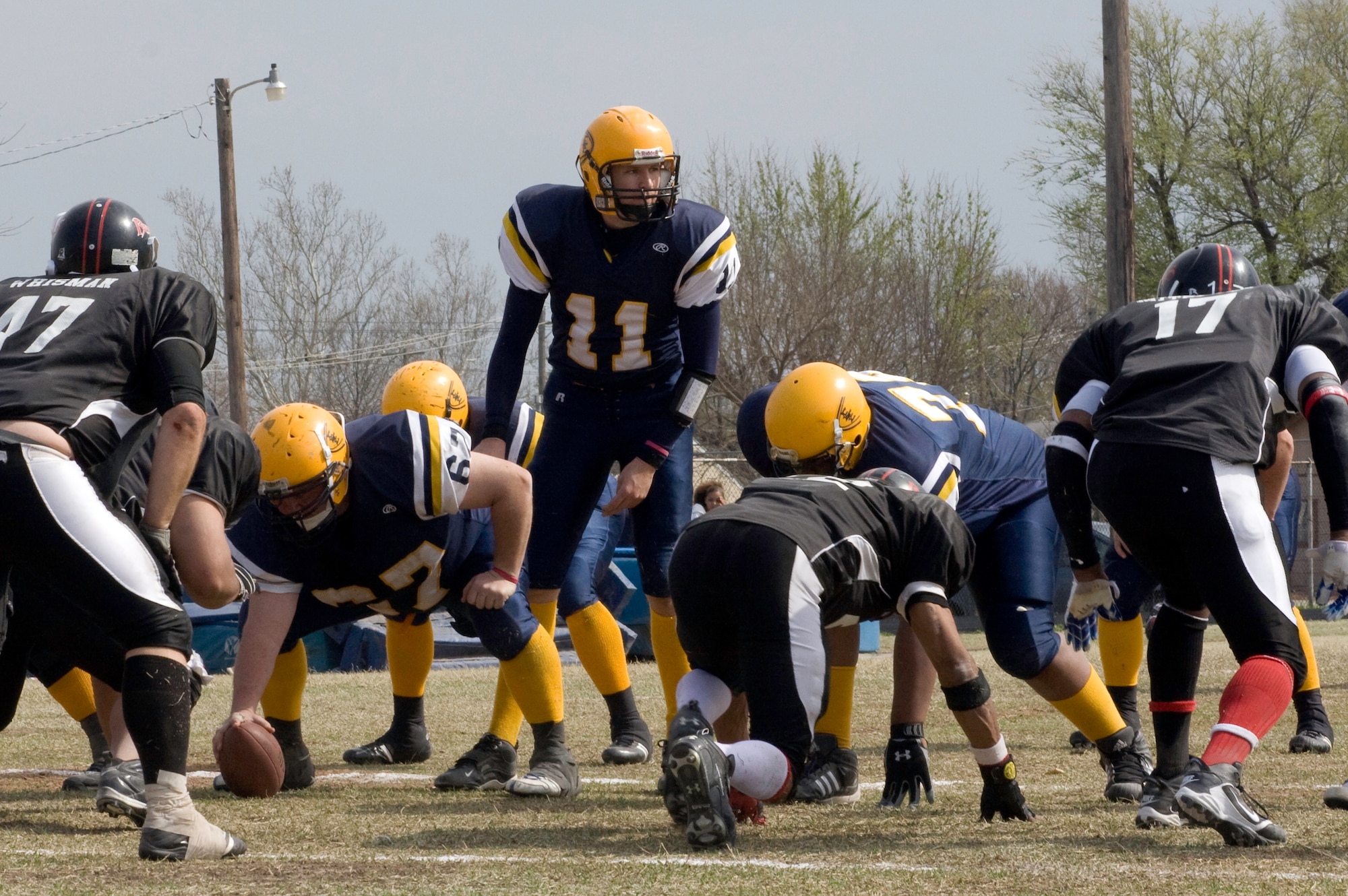 1st Lt. Chad McElvain, a Vance T-6 II Texan instructor pilot with the 33rd Flying Training Squadron and quarterback of the Enid Enforcers, prepares to call the next play on the football field. (Courtesy photo by Michael Kellner)