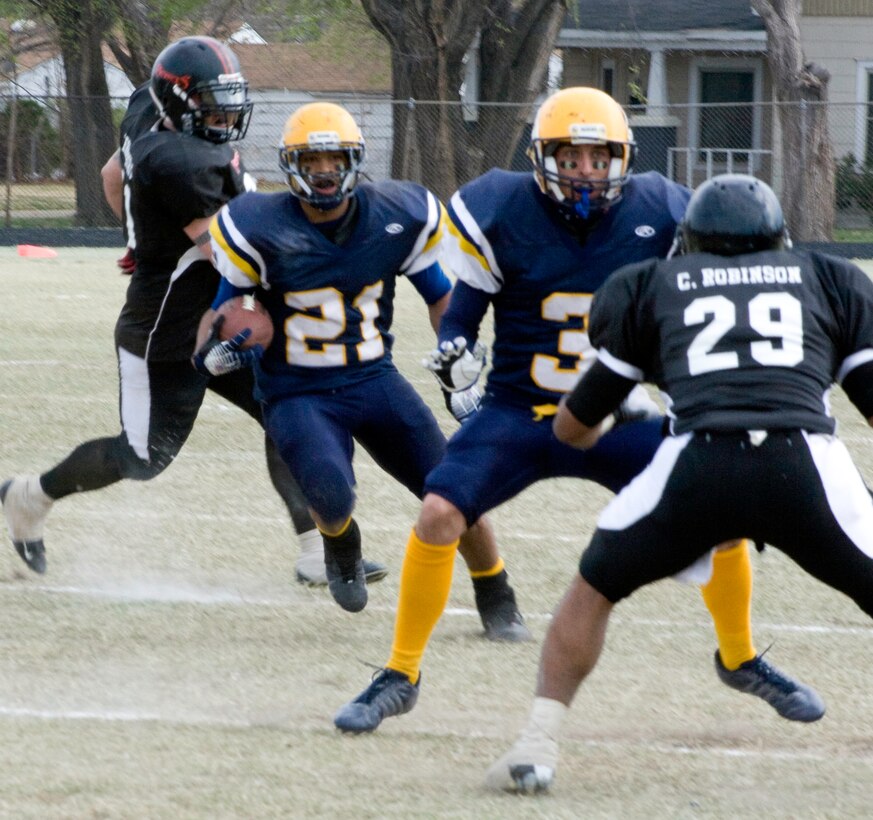 Senior Airman Todd Scott, an air traffic controller with the 71st Operations Support Squadron at Vance and a running back for the Enid Enforcers, cuts to evade defenders on a carry. (Courtesy photo by Michael Kellner)