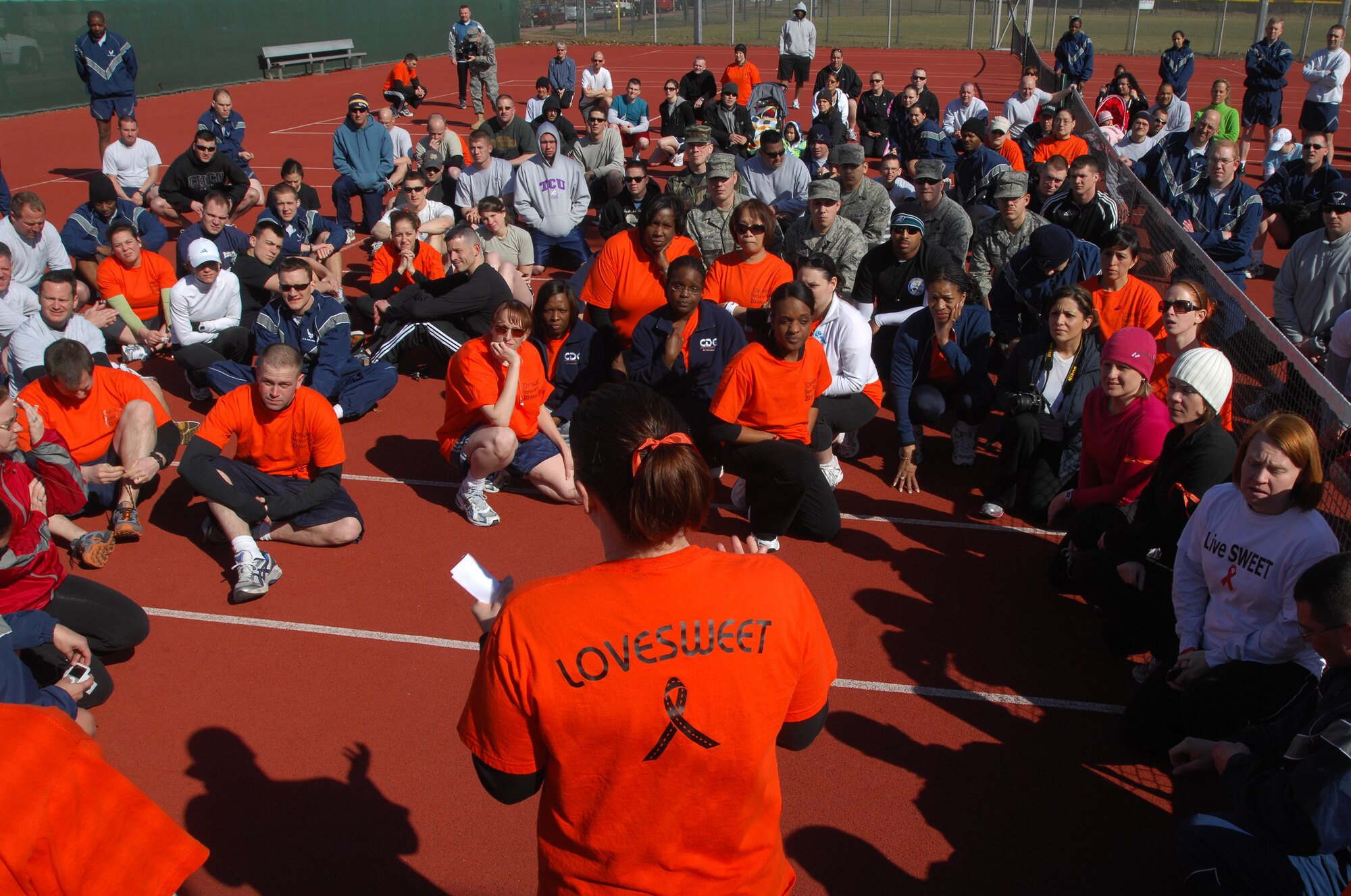 U.S. Air Force Tech. Sgt Monica Pubillones, USAFE Air Traffic Controller (center), says a few words before a 5K LOVESWEET memorial run, March 18, 2009, Ramstein Air Base, Germany. The run was in honor of Tech. Sgt. Jessica Sweet, 435th Communication Squadron supply troop, who lost a hard fought battle to Acute Myelogeneous Leukemia Feb. 12 (U.S. Air Force photo by Airman 1st Class Kenny Holston)