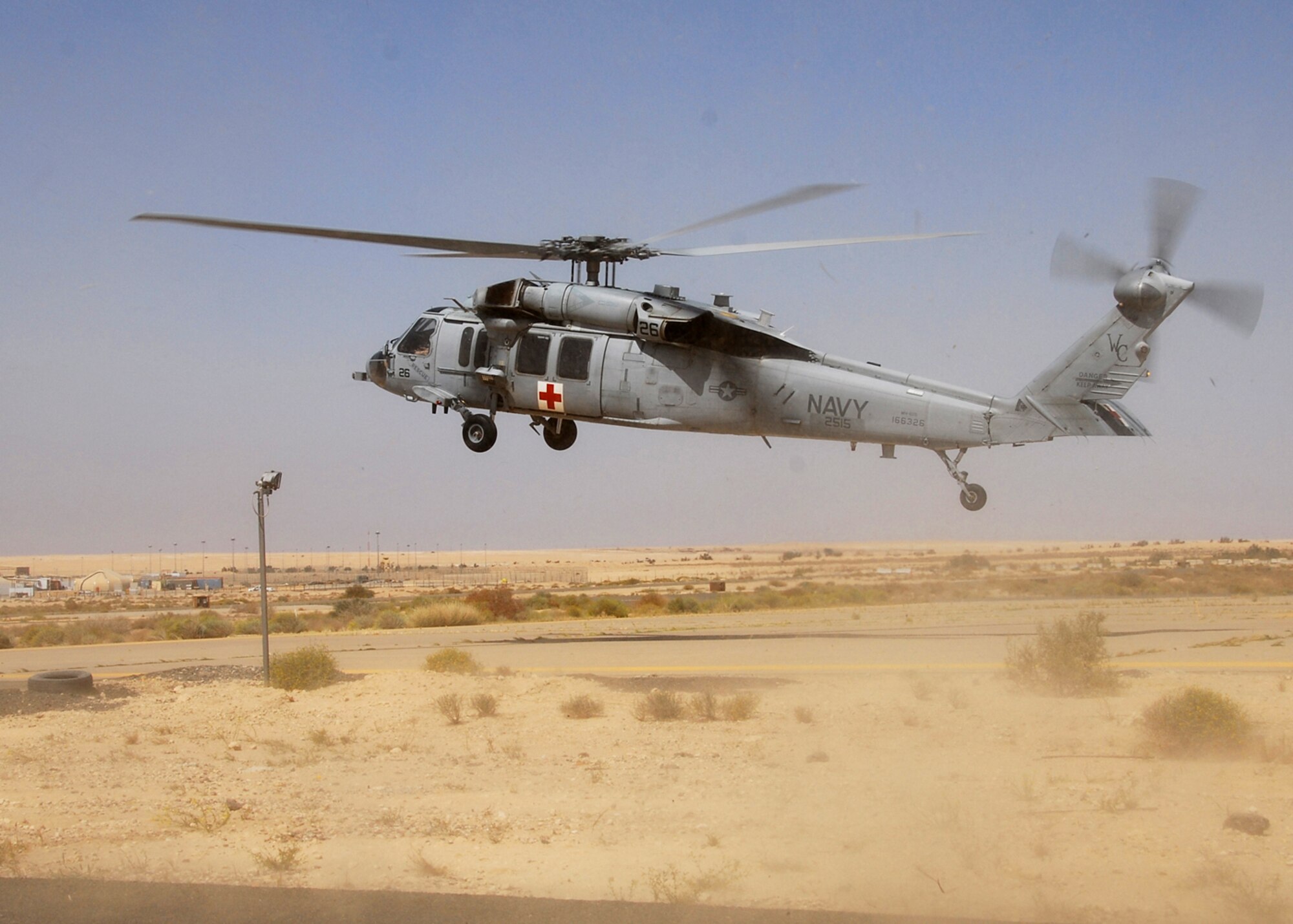 SOUTHWEST ASIA -- A Navy medevac helicopter from the 2515th Naval Air Ambulance, takes off from an air base in Southwest Asia after providing the 386th Expeditionary Medical Group Litter Management System Training, March 20. The 2515th Naval Air Ambulance is the only Naval medevac unit, here to support the Army, they are the only air ambulance that covers Southwest Asia, Southern Iraq and the Northern Arabian Gulf. (U.S. Air Force photo/ Senior Airman Courtney Richardson)