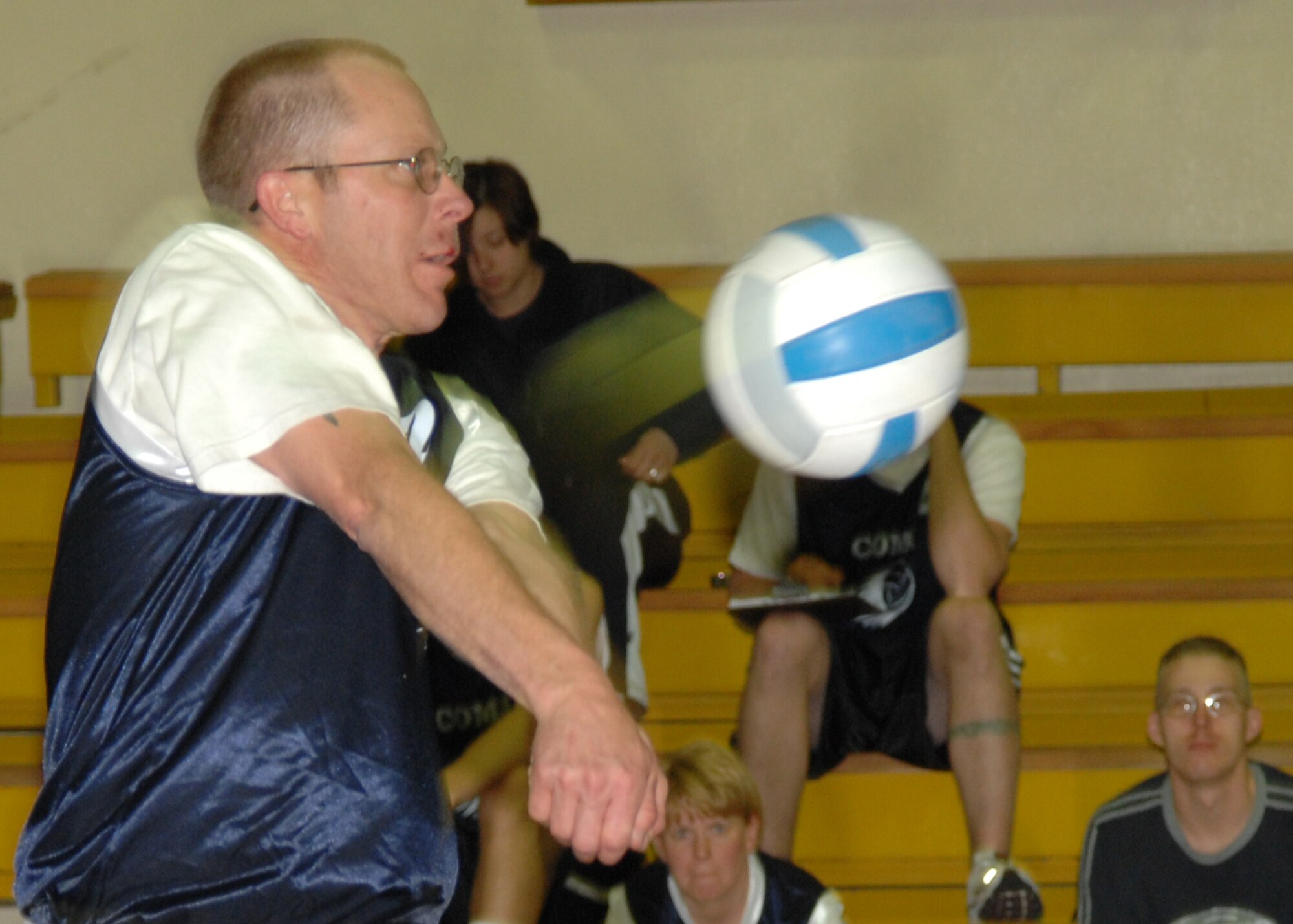 Keith Thomasson, 39th Communications Squadron volleyball team, bumps the ball during an intramural game at the Incirlik Fitness Center, Monday, Mar. 23, 2009. The civil engineer squadron team beat the CS team two games to one. (U.S. Air Force photo/Staff Sgt. Lauren Padden)