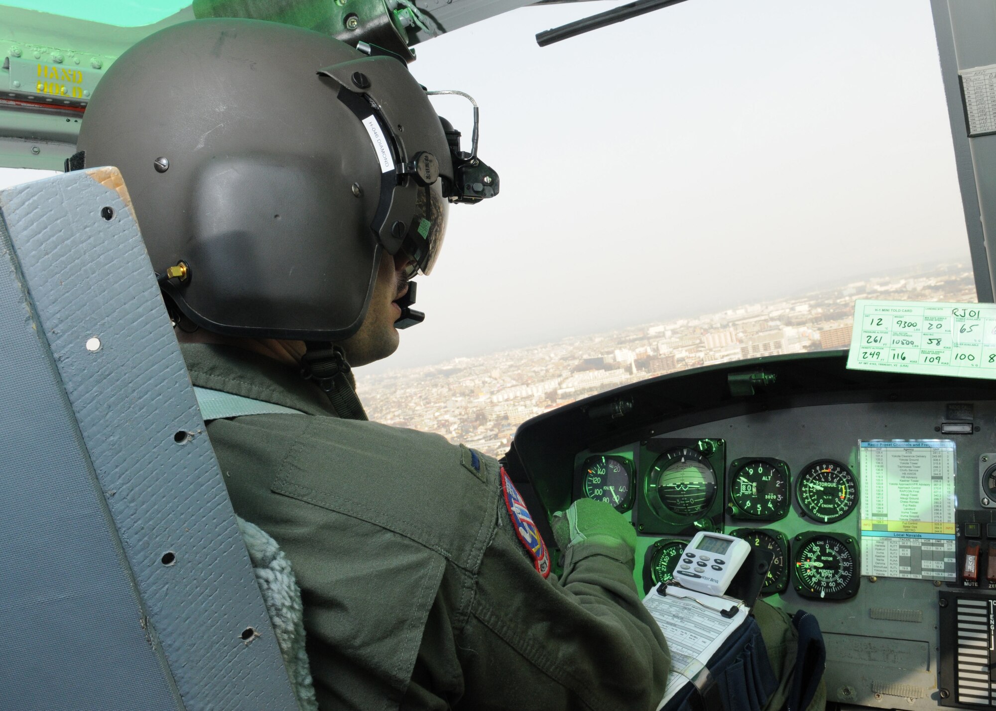 YOKOTA AIR BASE, Japan --  1st Lt. Matt Diamond, 459th Airlift Squadron pilot, flies a UH-1N Huey helicopter over the base March 17 to help the 374th Civil Engineer Squadron scan for leaks in the base's heat distribution system. (U.S. Air Force photo/Airman Sean Martin)

