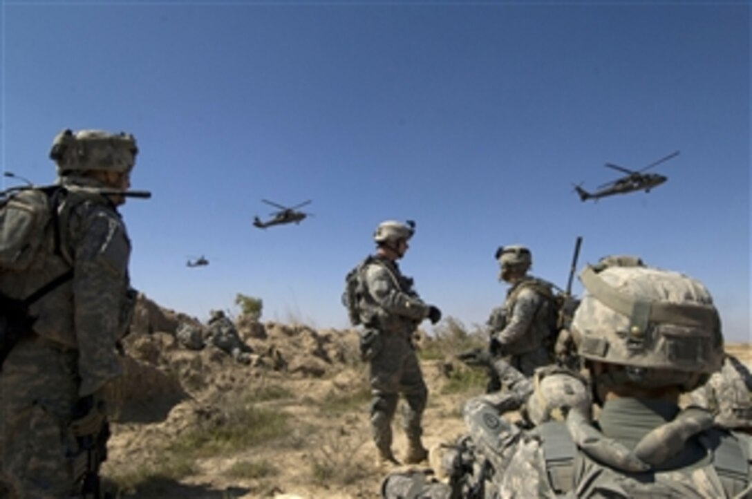 U.S. Army soldiers wait to be picked up by helicopters south of Balad Ruz, Iraq, on March 22, 2009.  The soldiers are assigned to Recon Platoon, 1st Battalion, 24th Infantry Regiment, 1st Stryker Brigade Combat Team, 25th Infantry Division.  