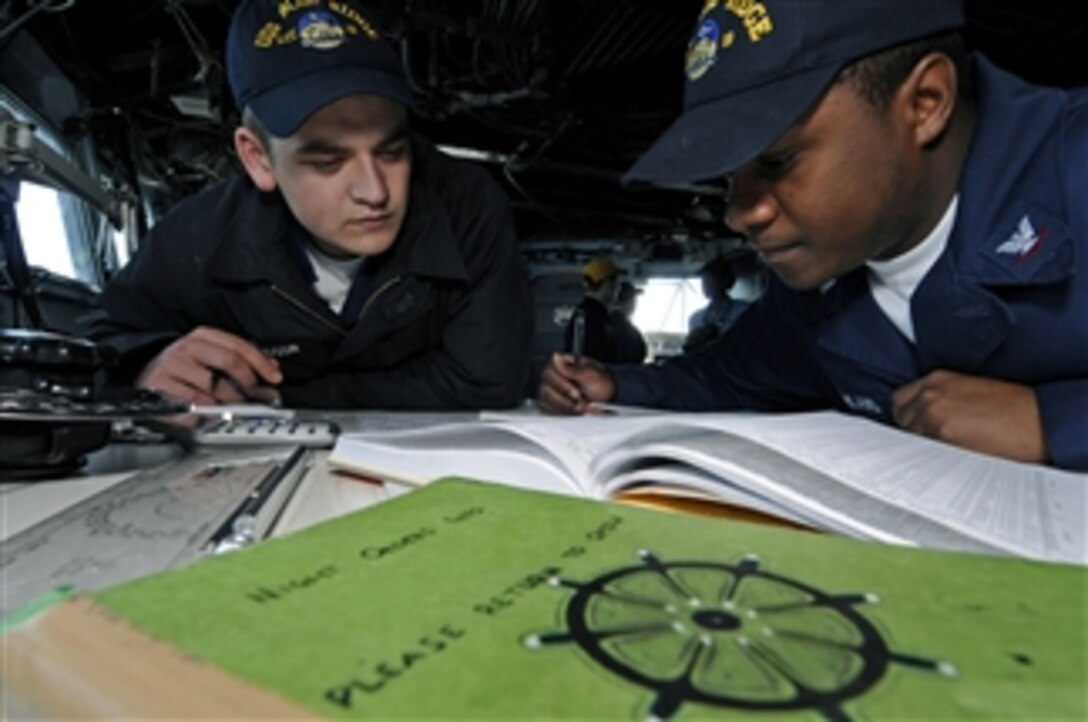 U.S. Navy Seaman Tim Davidson and Petty Officer 3rd Class Dexter McFarland, on the bridge aboard the amphibious command ship USS Blue Ridge (LCC 19), calculate the time of moonrise in the Pacific Ocean on March 23, 2009.  The ship serves under Commander, Expeditionary Strike Group 7 and Command Task Force 76, the Navy's only forward deployed amphibious force.  The Blue Ridge is the flagship for Commander, U.S. 7th Fleet.  