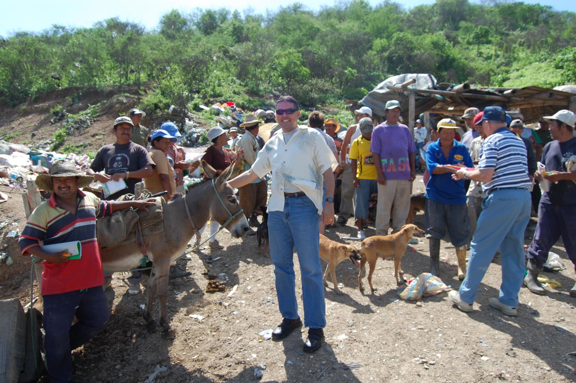 FORWARD OPERATING LOCATION MANTA, Ecuador -- Chaplain (Capt.) Gabriel Rios brings toiletries and visits with locals who work and live in Manta, Ecuador’s landfill. The captain is deployed to FOL Manta from Spangdahlem Air Base, Germany. (U.S. Air Force photo)  