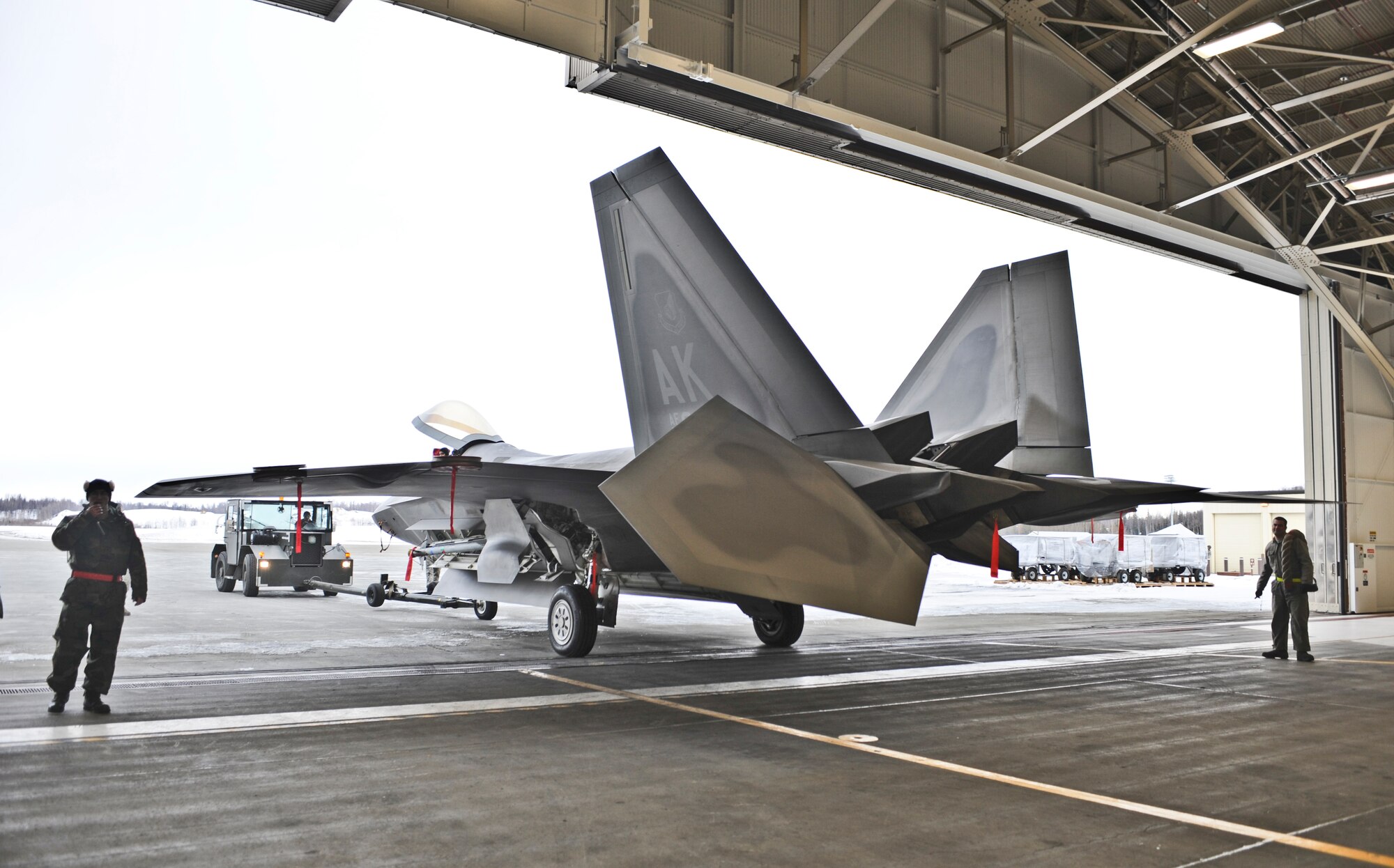 ELMENDORF AIR FORCE BASE, Alaska -- Raptors and maintenance equipment from the 525th Fighter Squadron are sheltered inside a hangar due to the ongoing eruptions of Mount Redoubt. (U.S. Air Force photo by Senior Airman Matthew Owens)