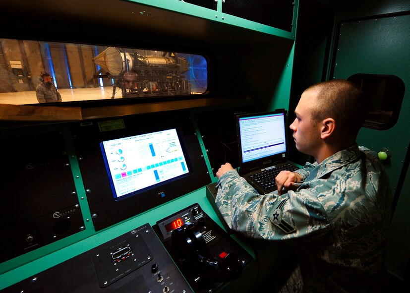 Airman 1st Class Michael Welch, a member of the 49th Maintenance Squadron, sits at the controls of a $10,000,000 jet engine from an F-22 Raptor during a routine maintenance test at Holloman AFB, Nm.16 Mar. A1C Welch is a Jet Engine Test Facility Journeyman who originally hails from Concord, New Hampshire. (U.S. Air Force Photo/TSgt Chris Flahive)