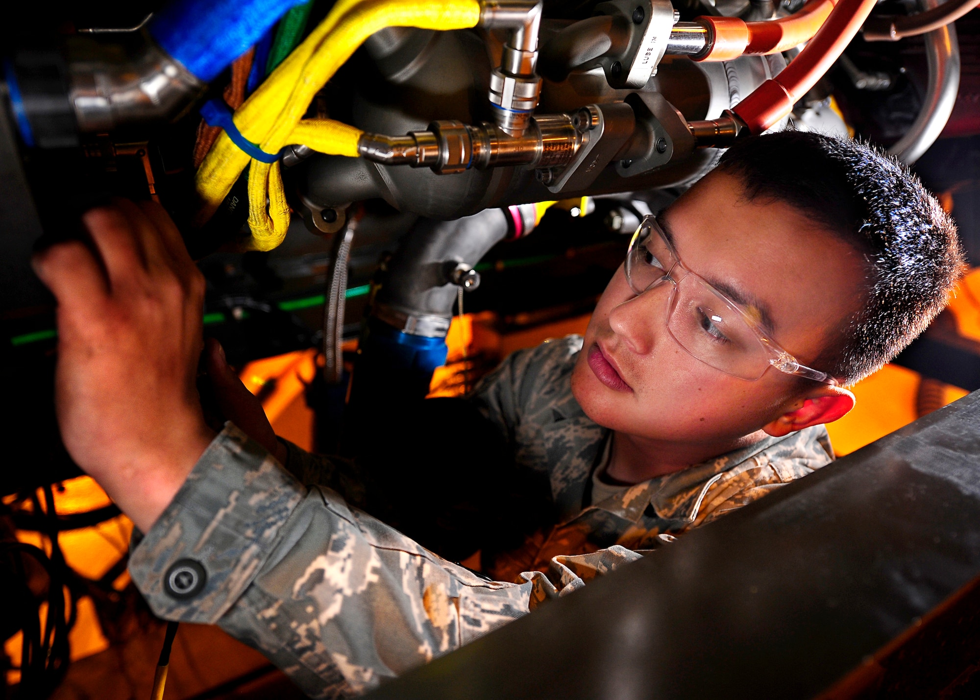 Senior Airman Steven Holland, a Jet Engine Test Facility Journeyman, performs a pre run inspection while testing the engine of an F-22 Raptor. SrA Holland is a member of the 49th Maintenance Squadron and is activley persuing a Federal Aviation Administration Air Frame and Power plant license. (U.S. Air Force Photo/TSgt Chris Flahive)
