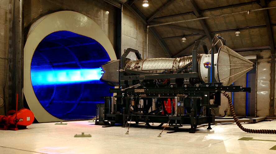 A Pratt & Whitney F119-PW-100 turbofan engine undergoes a routine performance test at the Holloman AFB Jet Engine Test Facility 17 March. The test facility is commonly referred to as the "hush House" because it allows engines to be run at full afterburner, as shown here, with minimal noise being allowed outside the facility. (U.S. Air Force Photo/TSgt Chris Flahive)