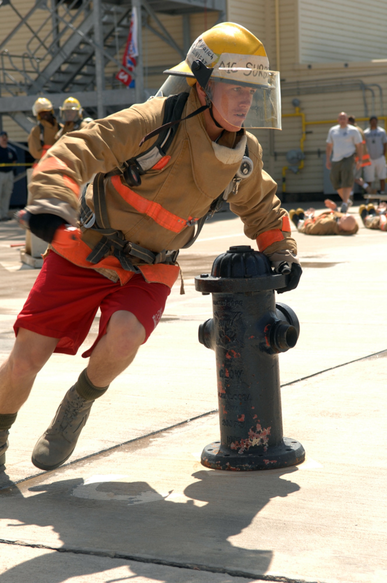Airman 1st Class Raymond Surber of the "Rockafellas" team dodges around a fire hydrant in the fourth portion of the Rookie Firefighter Combat Challenge March 21. (U.S. Air Force photo by Tech. Sgt. John Barton)