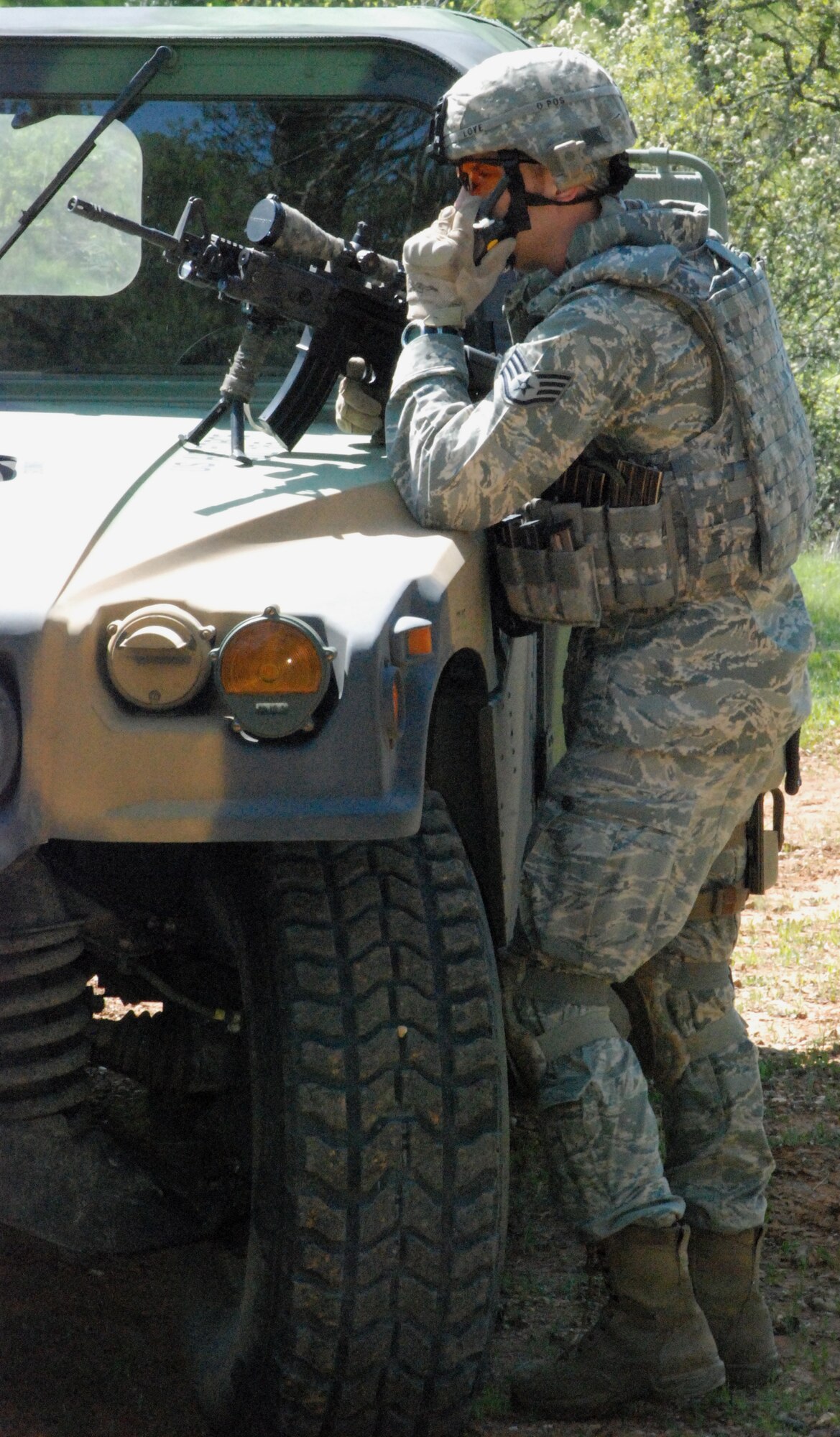 Staff Sgt. Scott Love, a 9th Civil Engineer Squadron explosive ordnance disposal technician, communicates with other EOD members March 24 during a training exercise. The EOD flight's training regime keeps them constantly prepared to deploy. (Photo by Airman 1st Class Chuck Broadway)