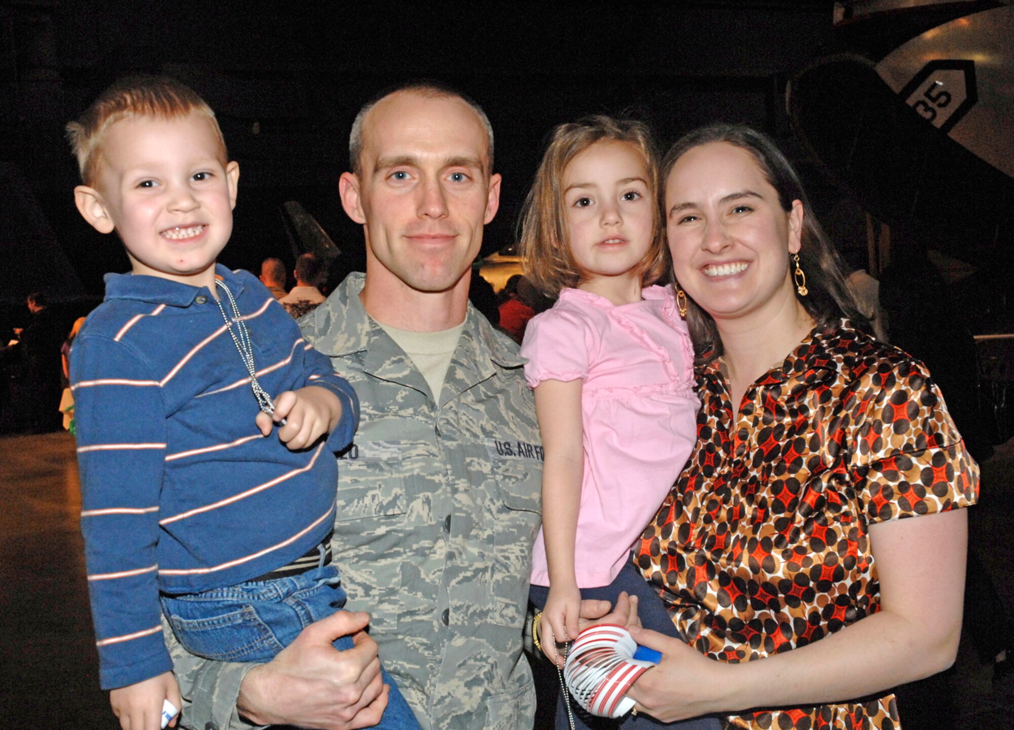 Staff Sgt. David Merlo, a Reservist with the 445th Civil Engineering Squadron at Wright-Patterson Air Force Base, Ohio, his wife Anna, and children Mathew and Maggie, were among more than 220 families who enjoyed the Heroes Welcoming Heroes event March 19 at the National Museum of the United States Air Force.  The event honored recently deployed military members and their families for their service and sacrifices. (U.S. Air Force photo/Al Bright)
