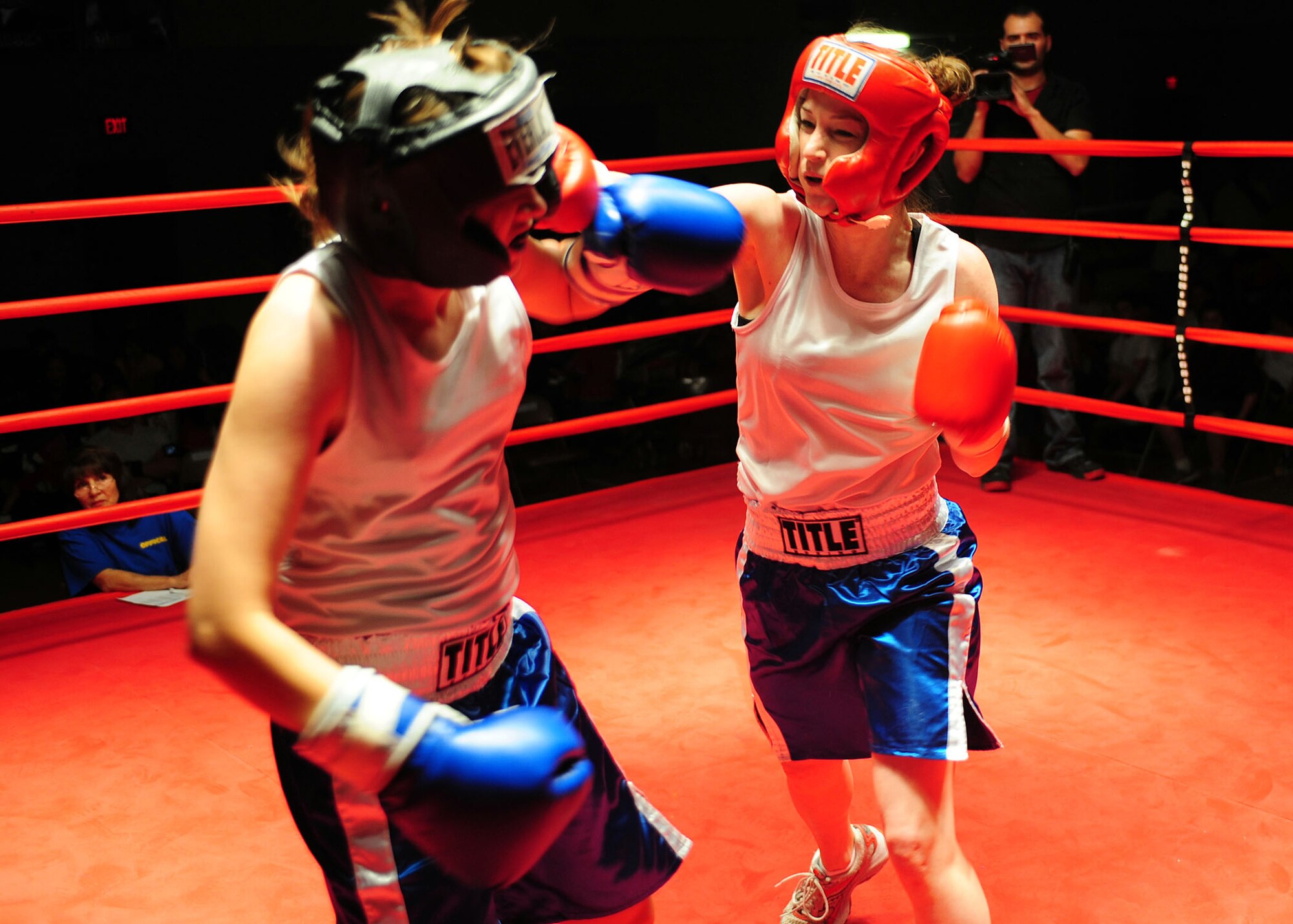 2nd Lieutenant Melissa Hancock, 49 Civil Engineer Squadron, lands a hard right hand in her bout against her second opponent of the night at the Raptor Rumble 3, at Holloman Air Force Base, N.M., March 20. Lieutenant Hancock won this fight after suffering a decision loss in her first one. (U.S. Air Force photo/ Airman 1st Class DeAndre Curtiss)