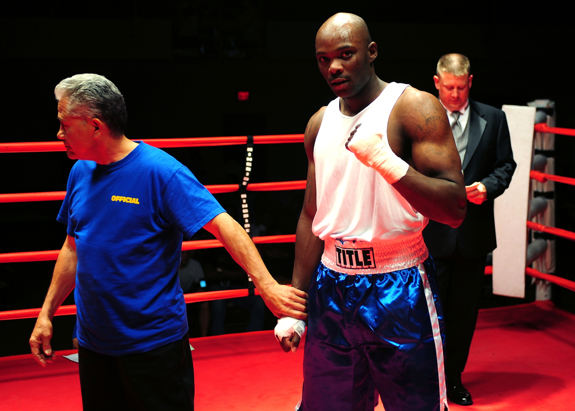 Senior Airman Labronze Paden, 49th Civil Engineer Squadron, pumps his fist in victory after a referee stoppage win in the second round in his bout with Senior Airman Ryan Gamboni, 49 CES, at Raptor Rumble 3 at Holloman Air Force Base, March 20. Airman Paden had one of four referee stoppages on the night. (U.S. Air Force photo/ Airman 1st Class DeAndre Curtiss)