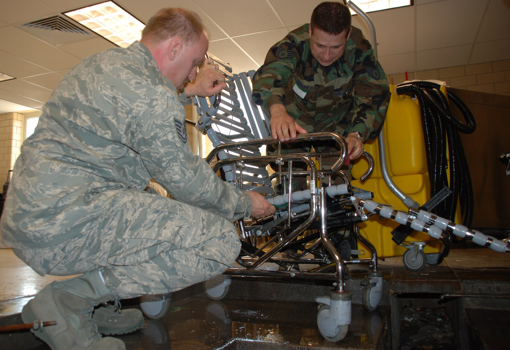 Tech. Sgt. Shawn Connolly, left, and Staff Sgt. Christopher Addley, work on a veteran?s wheelchair
at the Soldier?s Home in Holyoke. Sergeant Connolly has led a volunteer effort at the local home to maintain about 40

wheelchairs for the more than 200 veterans that live there. Sergeant Connolly is an active guard and reserve technician in
the isochronal inspection dock. Sergeant Addley is an air reserve technician assigned to the 439th Maintenance Squadron.

In all, 23 Westover maintainers have been involved in the wheelchair project. (photo by Tech. Sgt. Andrew Biscoe)