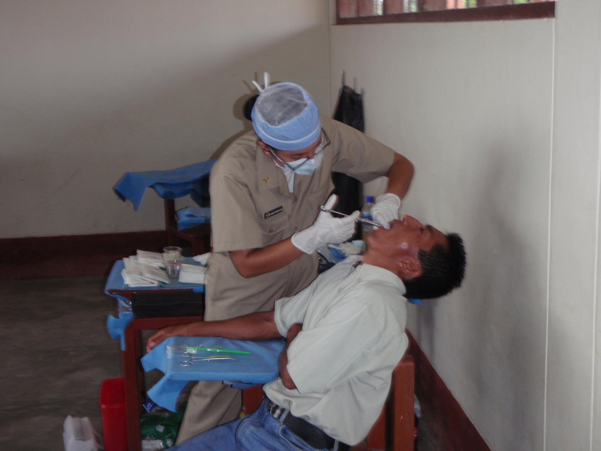 LORETO REGION, Peru -- Lt. (Dr) Blanca Montenegro, Peruvian Navy, injects a dental patient with anesthetic.  A team of 15 Air Force doctors and technicians, along with more than 50 Peruvian Navy, Ministry of Health, and civilian practitioners, treated patients in the remote region for two weeks as part of the ongoing Riverine Project, a three year humanitarian medical project sponsored by Twelfth Air Force (Air Forces Southern).  (U.S. Air Force photo by Master Sgt. Jesse Moreno)