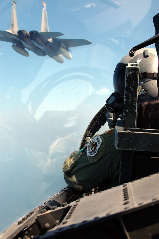 A pair of F-15s head toward a target banner to test fire their cannon while supporting the Weapons Systems Evbaluation Program. Members of the 125th Fighter Wing, Florida Air National Guard and 144 Fighter Wing, California Air National Guard participate in the weapons Systems Evaluation Program (WSEP) at Tyndall Air Force Base Fl.  The units teamed up with the 53 Weapons Evaluation Group  to "live fire" weapons from their F-15 Eagles and F-16 Vipers to test the peramiters of the weapons in relation to their aircraft.(U.S. Air Force photo by MSgt Shaun Withers) Released 