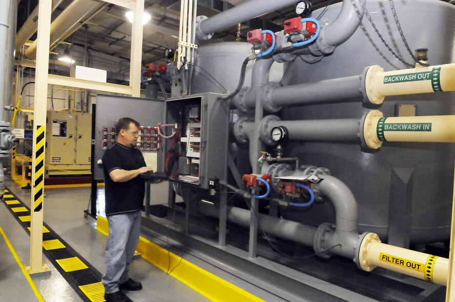 Andy Long, operations and maintenance technician, used a PLC (programable Logic Controller) to perform program modifications and test components.  U. S. Air Force photo by Sue Sapp