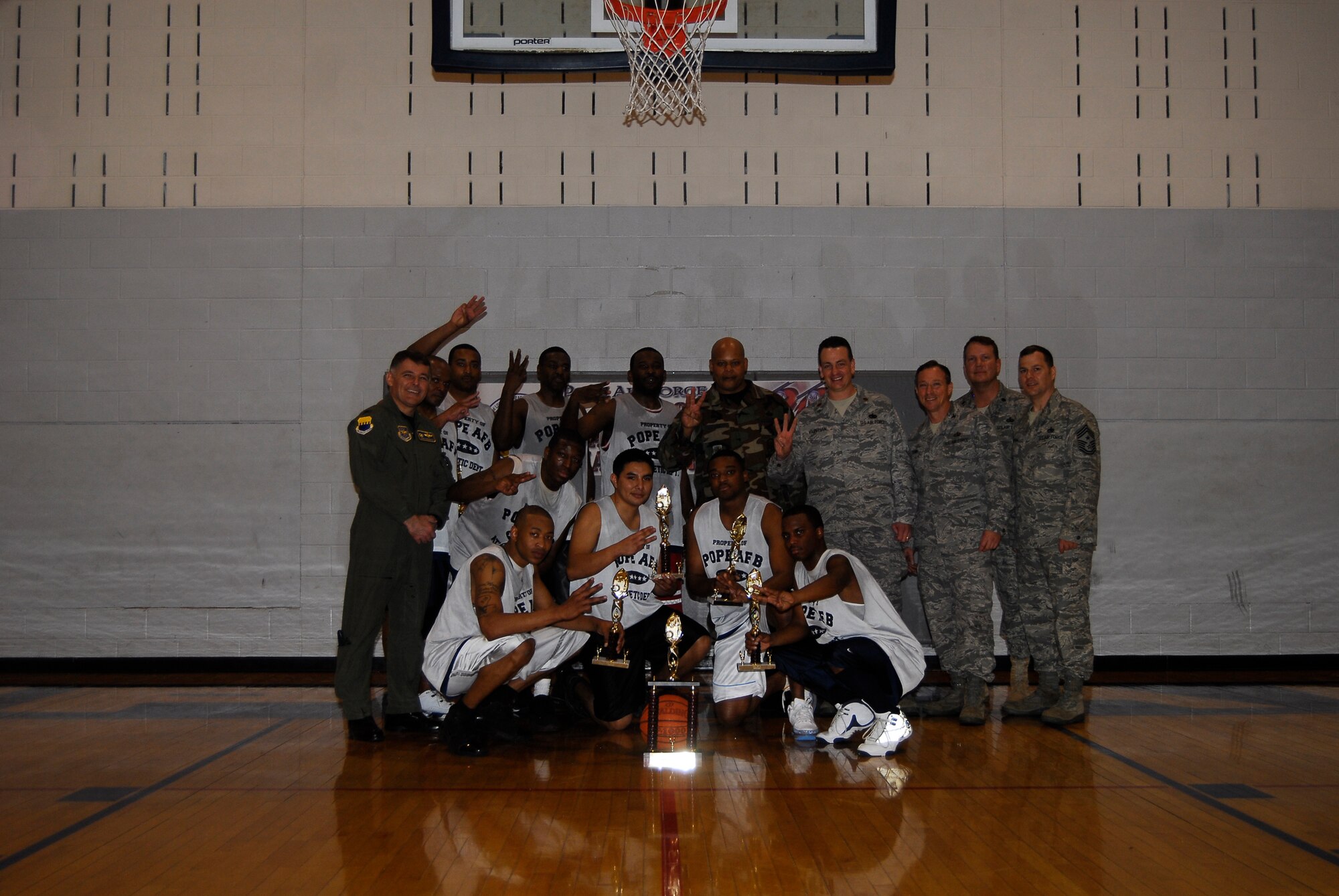 The 43rd Logistics Readiness Squadron (A) team poses after winning their 3rd consecutive Pope Intramural Basketball Championship March 6. (U.S. Air Force Photo by Irvin Gourdine)