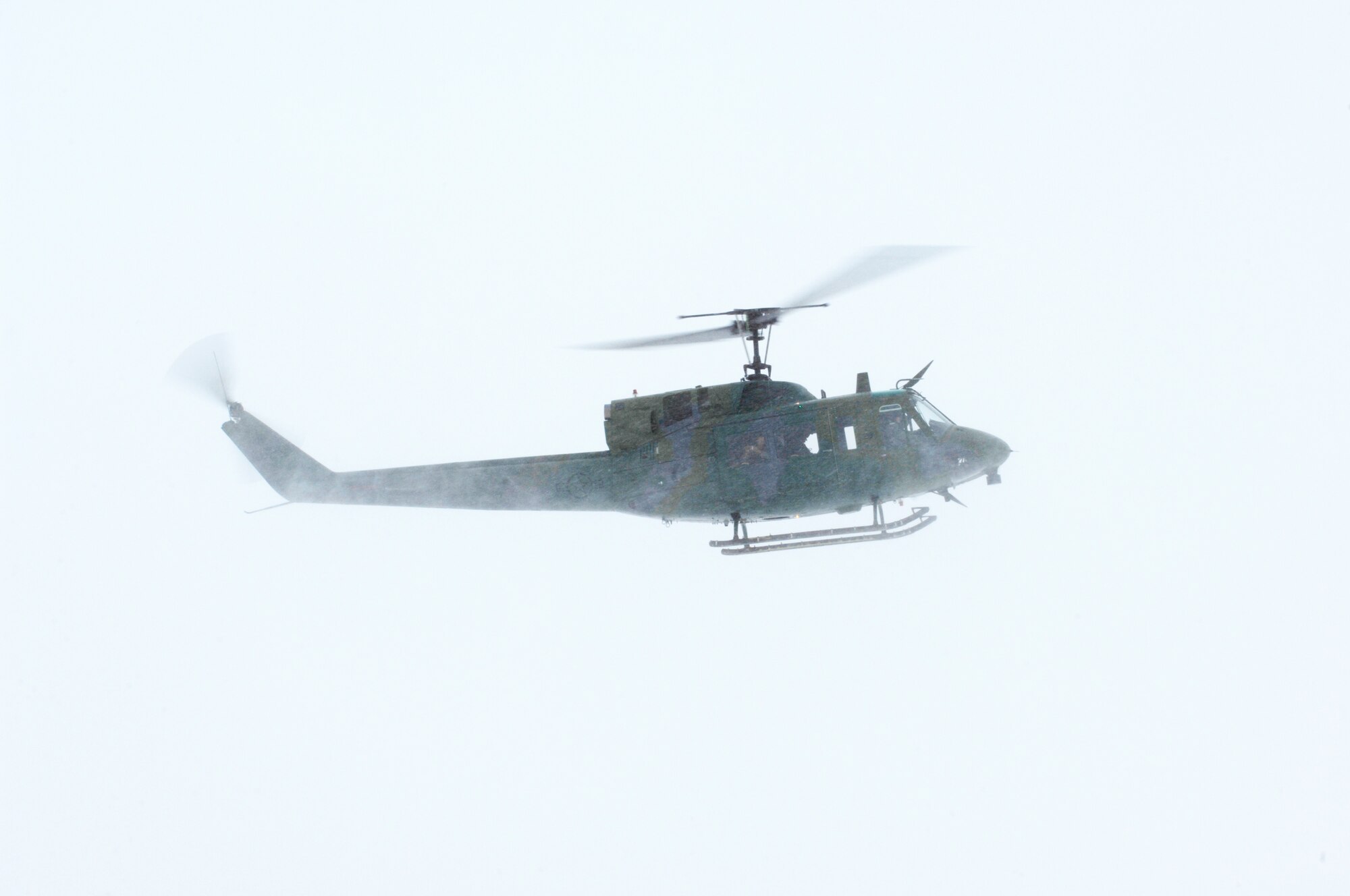 A UH-1N Huey takes off to assist in disaster relief efforts from flooding in Bismarck, N.D., March 25 from Minot Air Force Base, N.D. Eight crewmembers and two helicopters from the 54th Helicopter Squadron are deploying to aid the recovery. (U.S. Air Force photo/Senior Airman Joe Rivera) 
