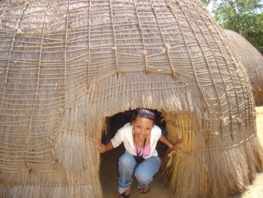 Tech. Sgt. Dawn Scott, 512th Logisitcs Readiness Squadron supply management specialist, visited a local mud-hut home in Swaziland, Africa. She and her family lived in Africa during her duty as an American diplomat to the U.S. Embassy in Swaziland. She and her family returned to Africa months later after Sergant Scott took a job as human resources director to the U.S. Embassy in Tunisia. (submitted photo)                                