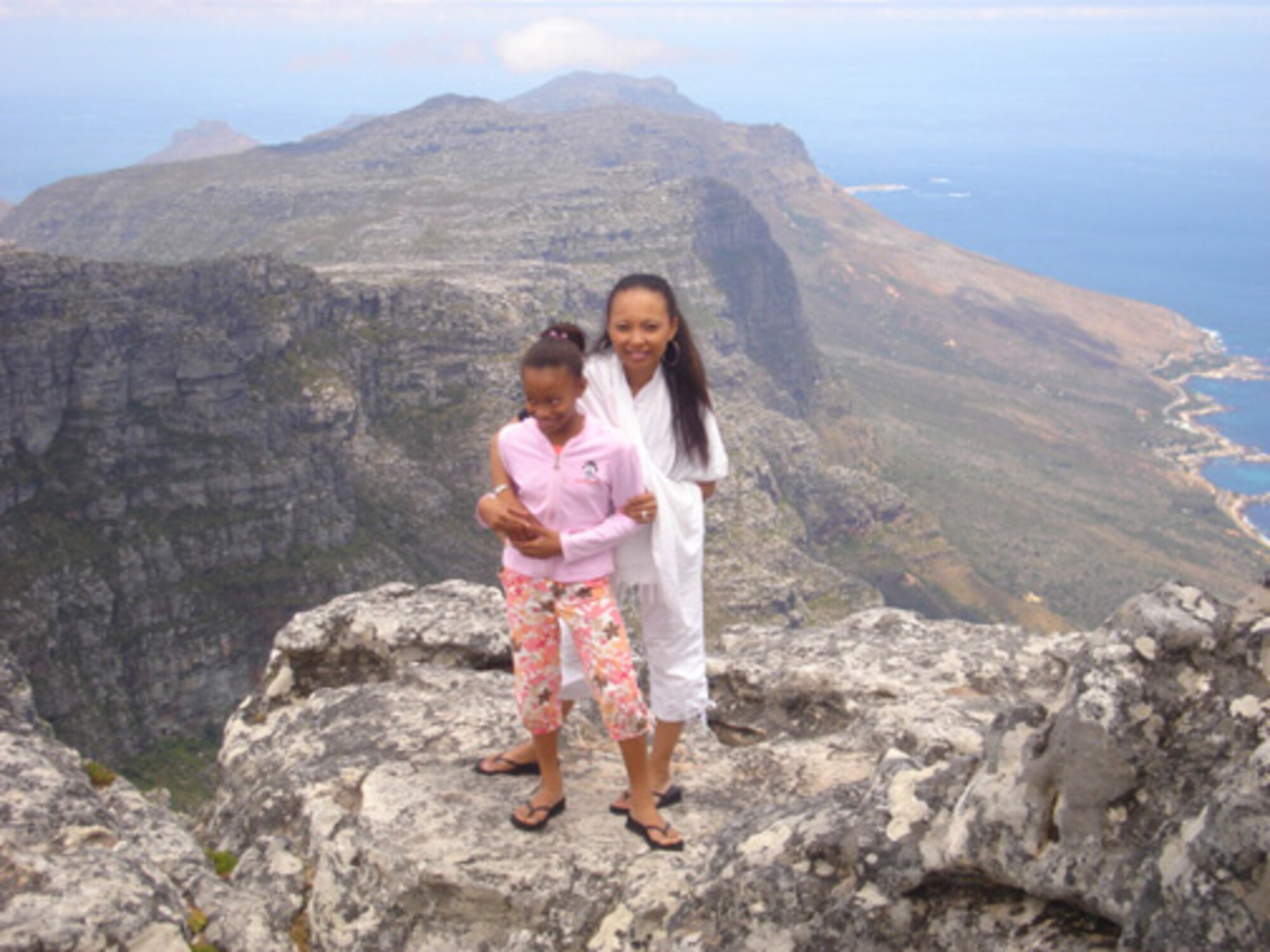 Tech. Sgt. Dawn Scott, 512th Logisitcs Readiness Squadron supply management specialist, and daughter, Chloe, visited Table Mountain in Capetown, South Africa. Sergeant Scott's family lived in Africa during her duty as an American diplomat to the U.S. Embassy in Swaziland. She and her family returned to Africa months later after Sergant Scott took a job as human resources director to the U.S. Embassy in Tunisia. (submitted photo)                        