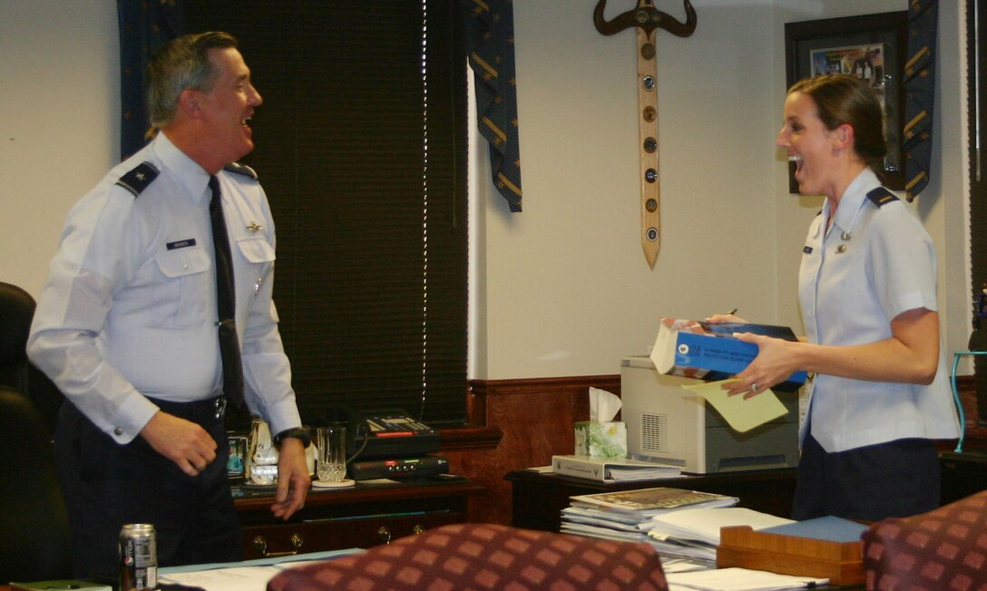 Brig. Gen. O.G. Mannon, 82nd Training Wing commander, suprises 2nd Lt. Jenny Liabenow, 82nd TRW project manager, March 23 with the news that she was accepted into the Funded Legal Education Program. Lieutenant Liabenow was one of two in the Air Force accepted into the program that allows officers to go to law school for the Air Force. (U.S. Air Force photo/Airman 1st Class Candy Miller)