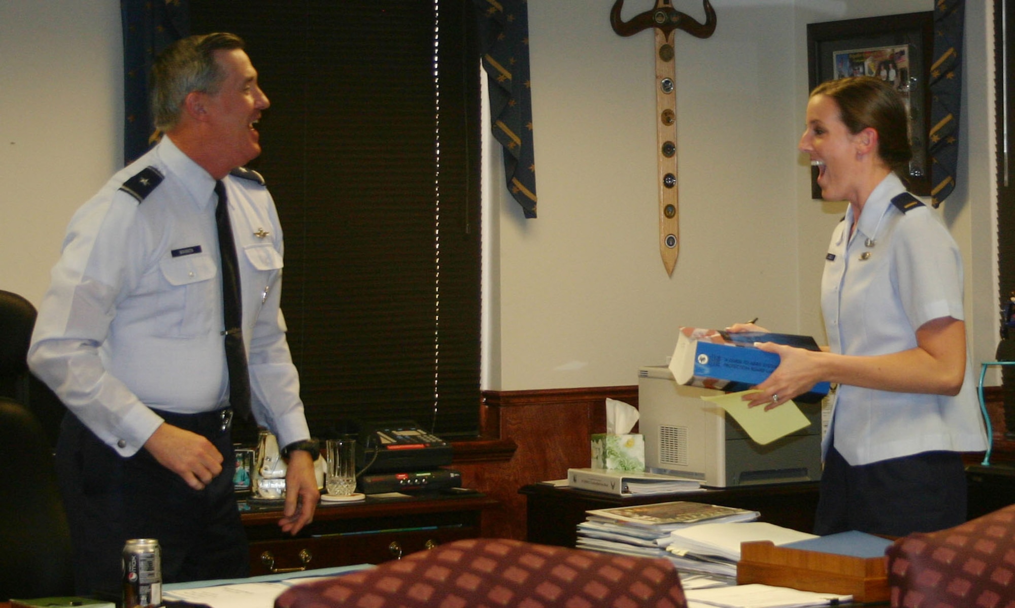Brig. Gen. O.G. Mannon, 82nd Training Wing commander, suprises 2nd Lt. Jenny Liabenow, 82nd TRW project manager, March 23 with the news that she was accepted into the Funded Legal Education Program. Lieutenant Liabenow was one of two in the Air Force accepted into the program that allows officers to go to law school for the Air Force. (U.S. Air Force photo/Airman 1st Class Candy Miller)