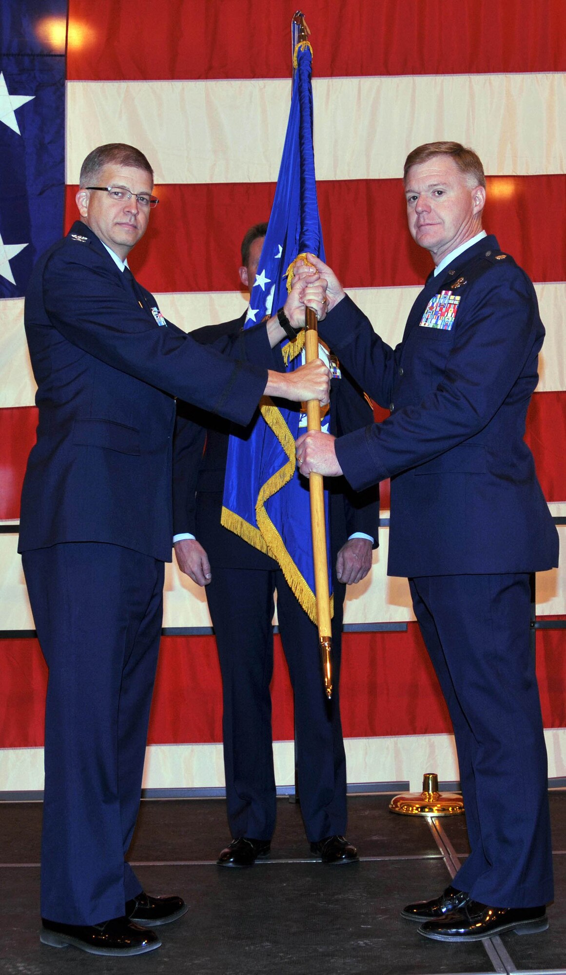 Lt. Col. Ronald Wilt receives the flag from Col. Tim Tarchick, 934th Airlift Wing commander, officially assuming command of the 934th Operations Group. Lt. Col. Wilt will be promoted to Colonel on April 1. (Air Force Photo/Master Sgt. Paul Zadach)
