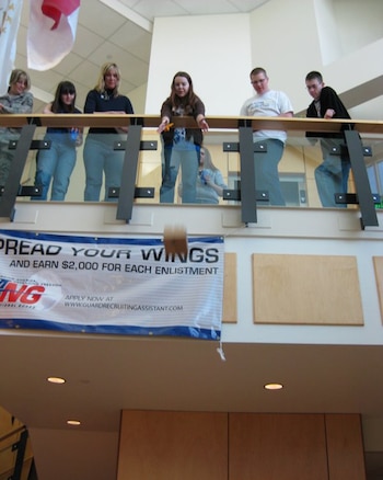 Master Sgt. Sandee Eisert, Katie Scoresby, Debbie Ramsay, Kyler Brunsen and Jeff Reading watch as Nevin Dewitt drops "Humpty Dumpty" to a target below.  The activity was part of a team building exercise as eight teens from around the state met at the Utah Air National Guard base to learn more about their roles as the first "Speak Out for Military Kids" team in the state.  SOMK is a youth-led, adult-sponsored program created to help educate communities about military deployment issues and the effect it has on military families.  Each teen has experienced either a mom or dad being deployed and knows first-hand how kids struggle while a parent is away serving their country.
Courtesy photo.