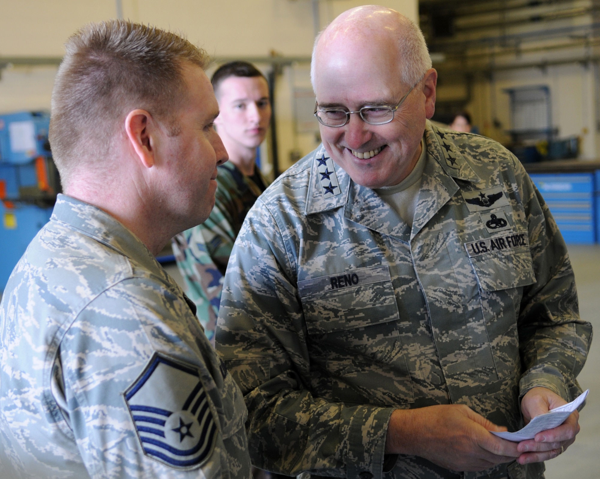 Lt. Gen. Loren M. Reno, the deputy chief of staff for logistics installations and mission support headquarters U.S. Air Force, shares a laugh with Master Sgt. Maurice Milstead during his tour of the sheet metal shop here March 20, 2009. General Reno was invited to be the guest speaker for the 100th Maintenance Group's 2008 “Knucklebuster” banquet. He was also able to incorporate a site visit during his short time in England. (U.S. Air Force photo by Staff Sgt. Jerry Fleshman)