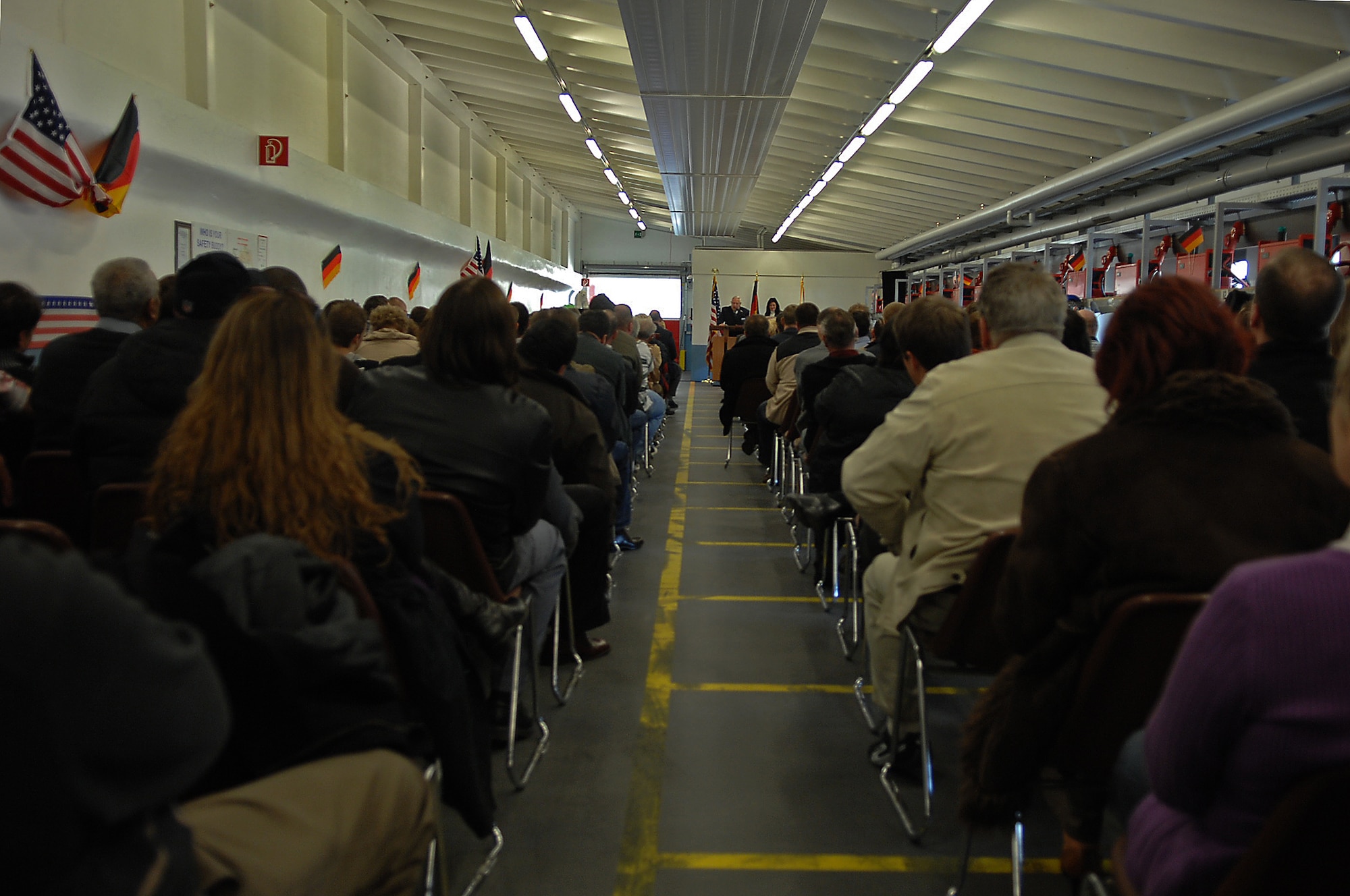 Employees and friends of Kaiserslautern Cold Storage attend a ceremony commemorating KCS's 50th anniversary, Ramstein Air Base, Germany, March 20, 2009. (U.S. Air Force photo by Airman 1st Class Tony R. Ritter)