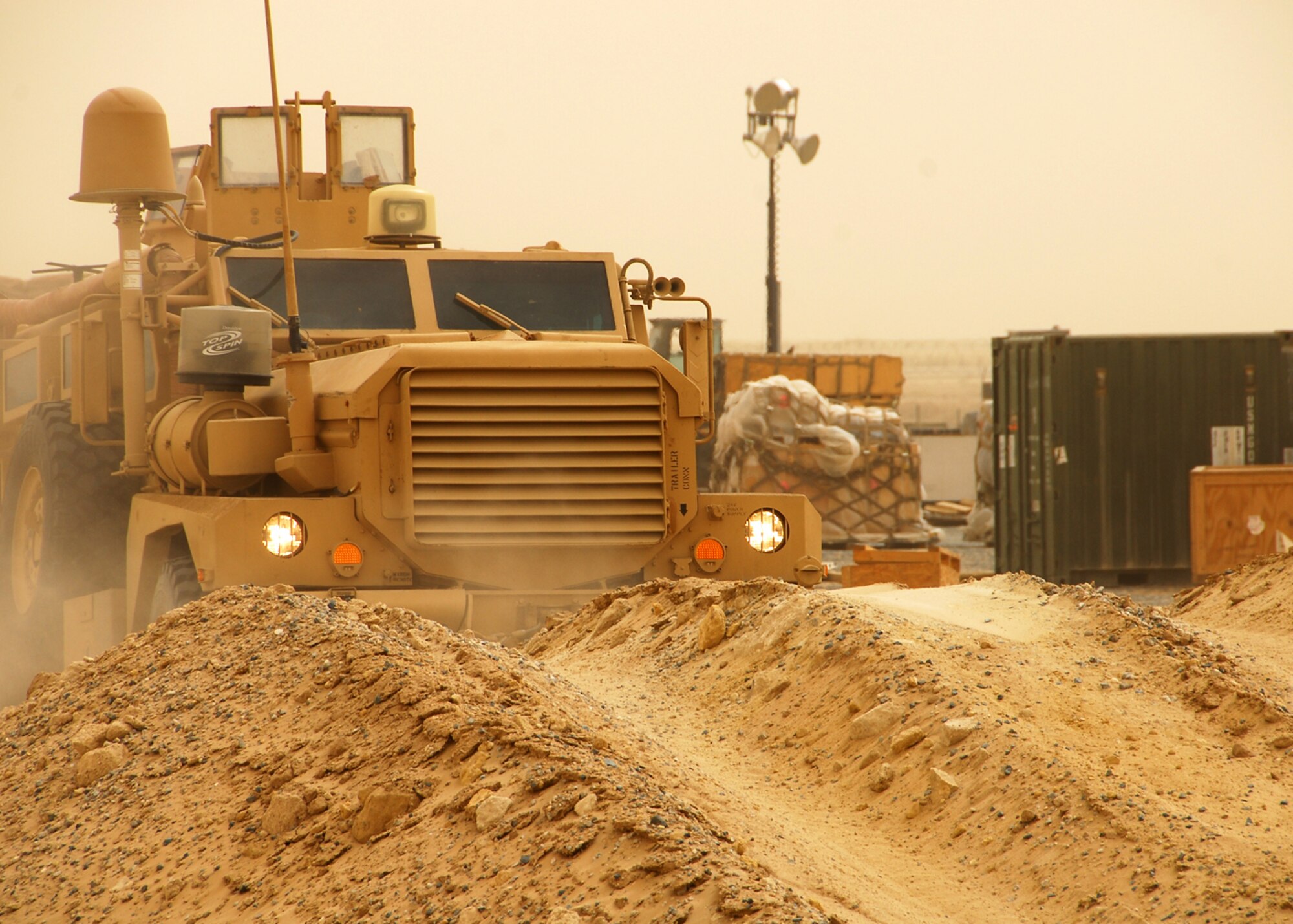 SOUTHWEST ASIA -- A Cougar, a Mine Resistant Ambush Protected vehicle, gets in gear to drive on rough terrain during MRAP training at an air base in Southwest Asia, March 24. Although the Cougar has a lower center of gravity, all MRAPS are subject to rollovers, making training to operate the 42,000 pound vehicle essential. (U.S. Air Force photo/ Senior Airman Courtney Richardson)