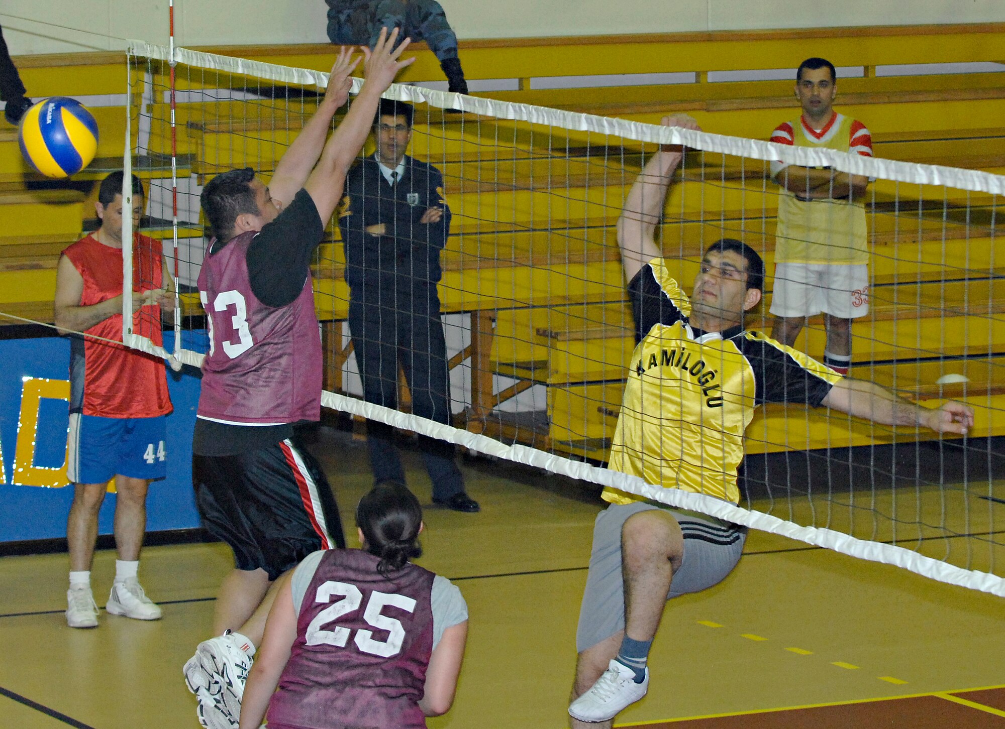 Philip Santos, Team 2, barely misses blocking the ball returned over the net by Mustafa, Maintanence 2, during a volleyball game, Tuesday, March 24, 2009 at the Incirlik Fitness Center. Maintenance 2, made up of personnel from the Turkish air force, beat Team 2, made up of personnel from the U. S. Air Force, with a score of 25-8. The U.S. and Turkish Air Forces have volleyball matches scheduled for 12:00 p.m. in the Incirlik Fitness Center all week increase the good relations between the U.S. Air Force and their host nation counterparts. (U.S. Air Force photo by Senior Airman Benjamin Wilson, 39th Air Base Wing Public Affairs)